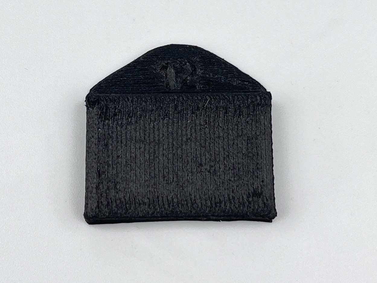Flow rate +12: over-extrusion with rough wavy surface and merged lines