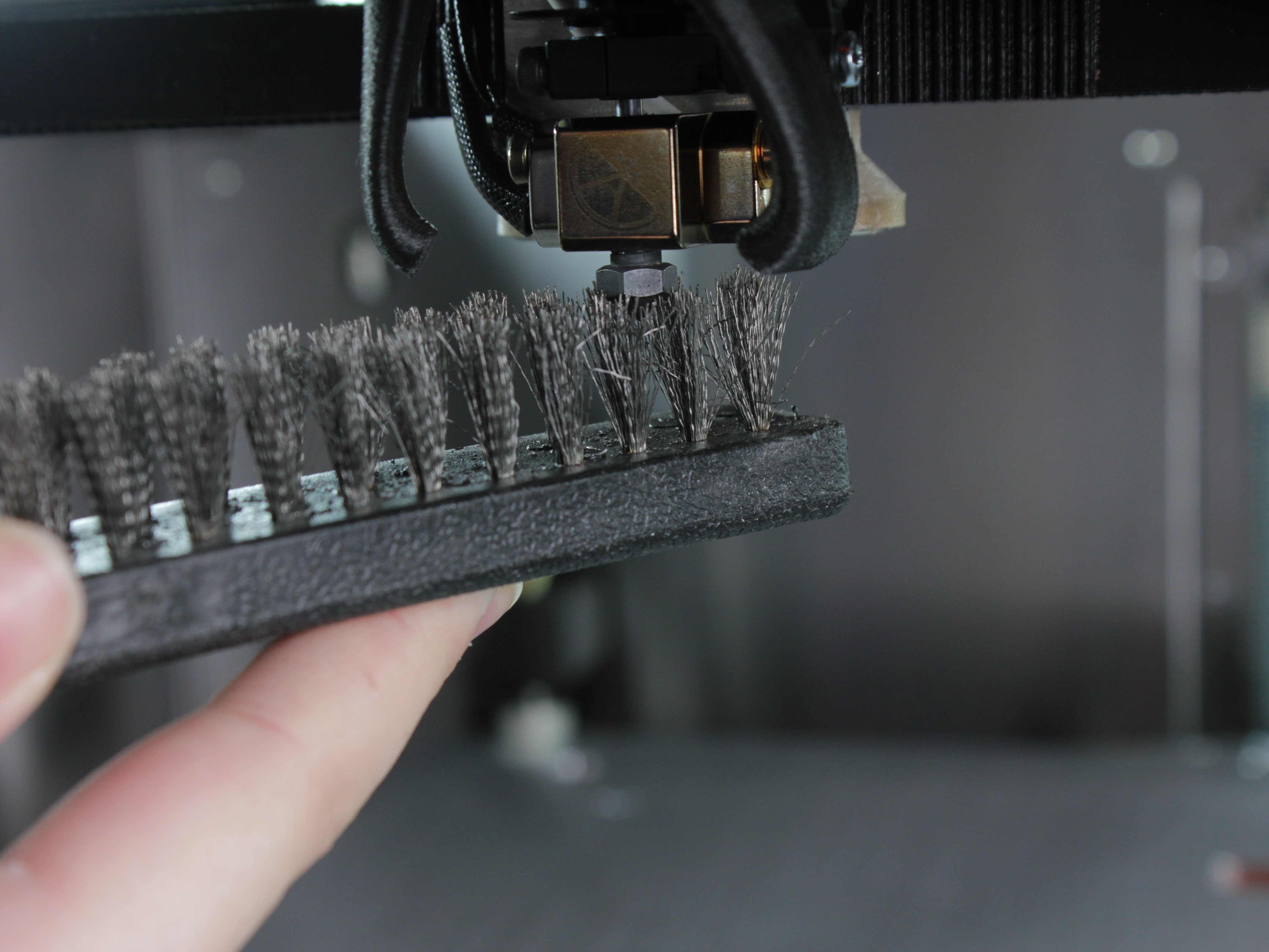 Cleaning nozzle with brass wire brush