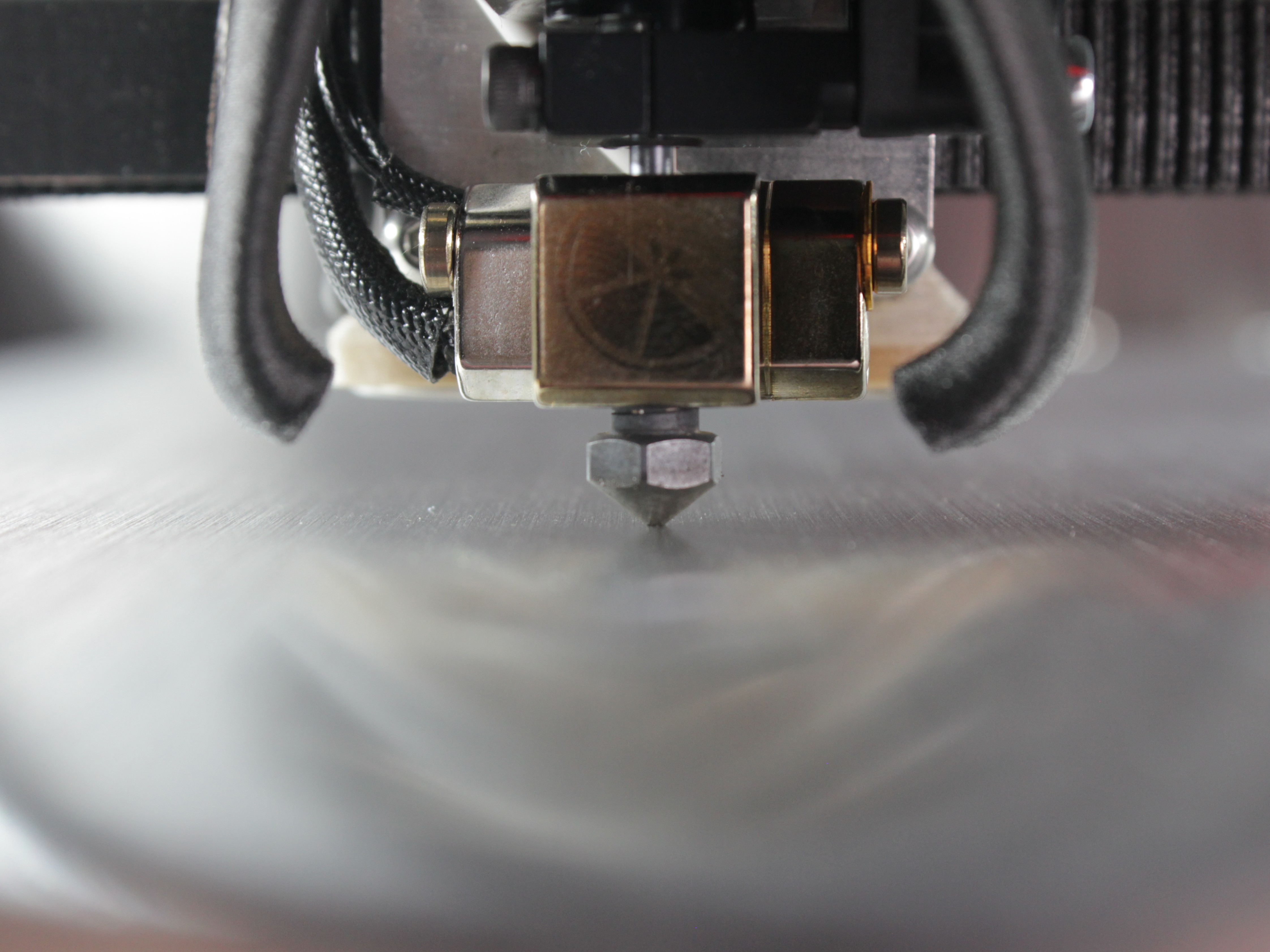 Nozzle probing against bed surface