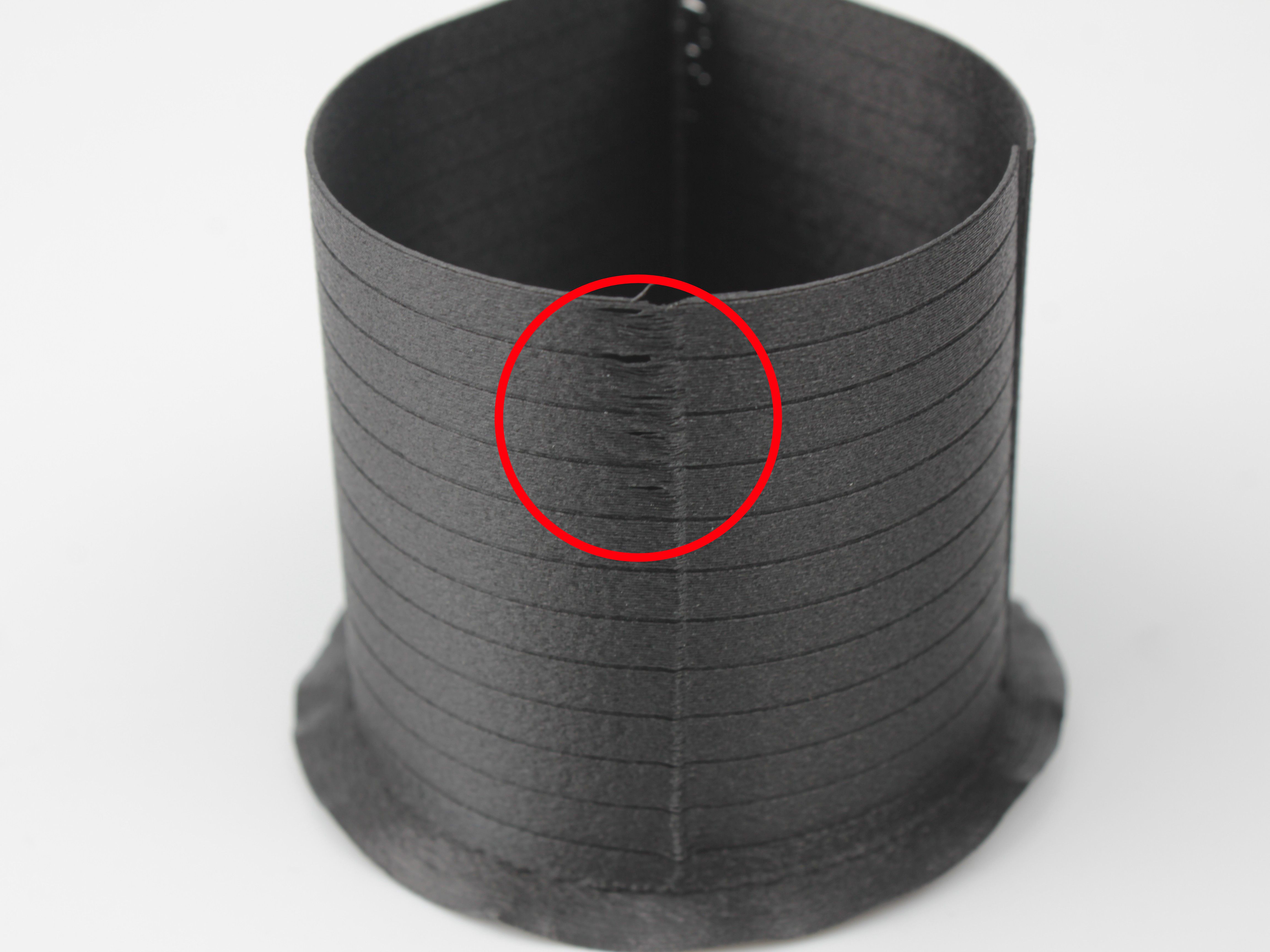 Pressure advance too low - visible bulge where material oozed out
