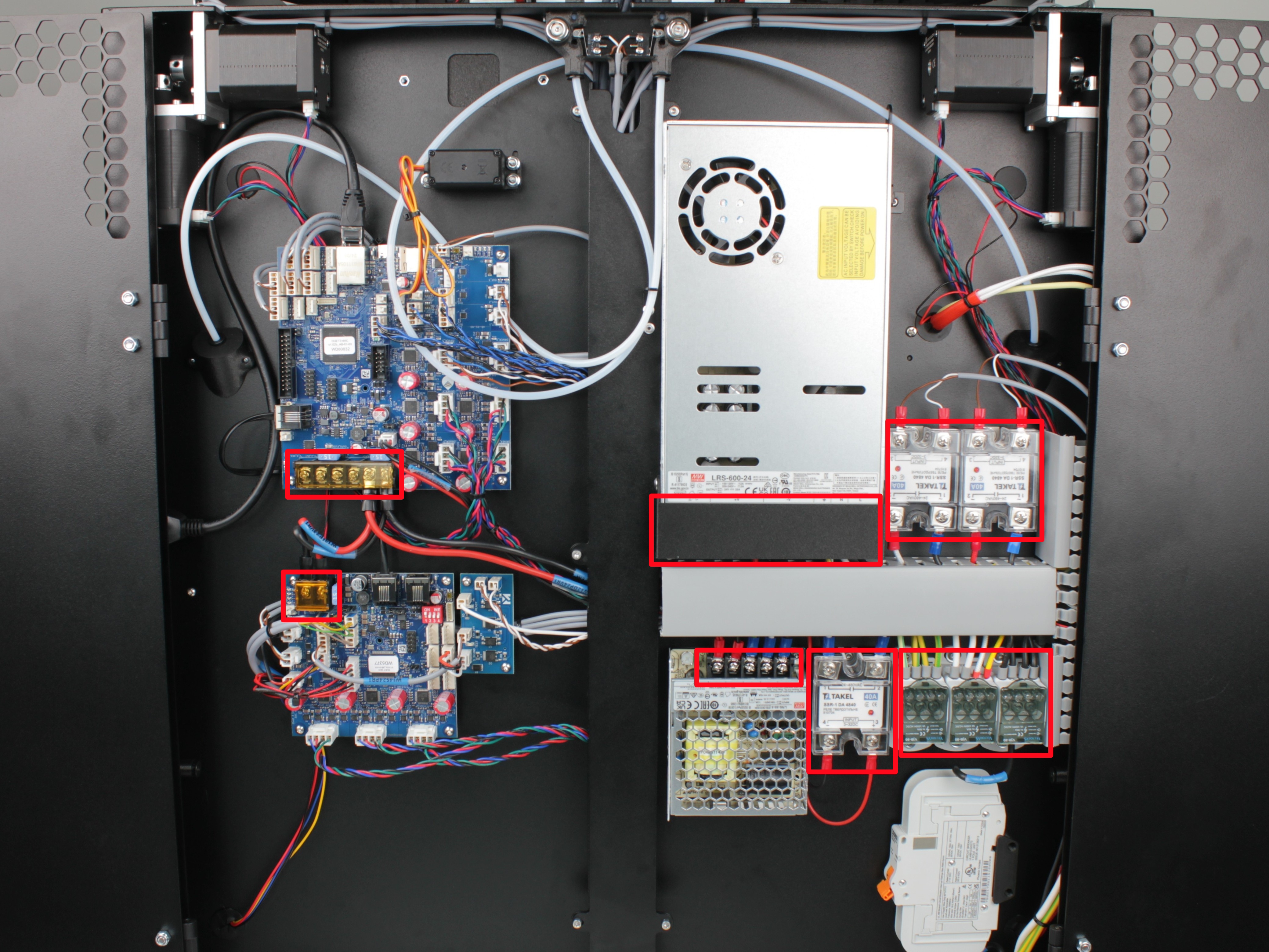 Electronics bay overview with marked terminal block locations requiring screw tightening