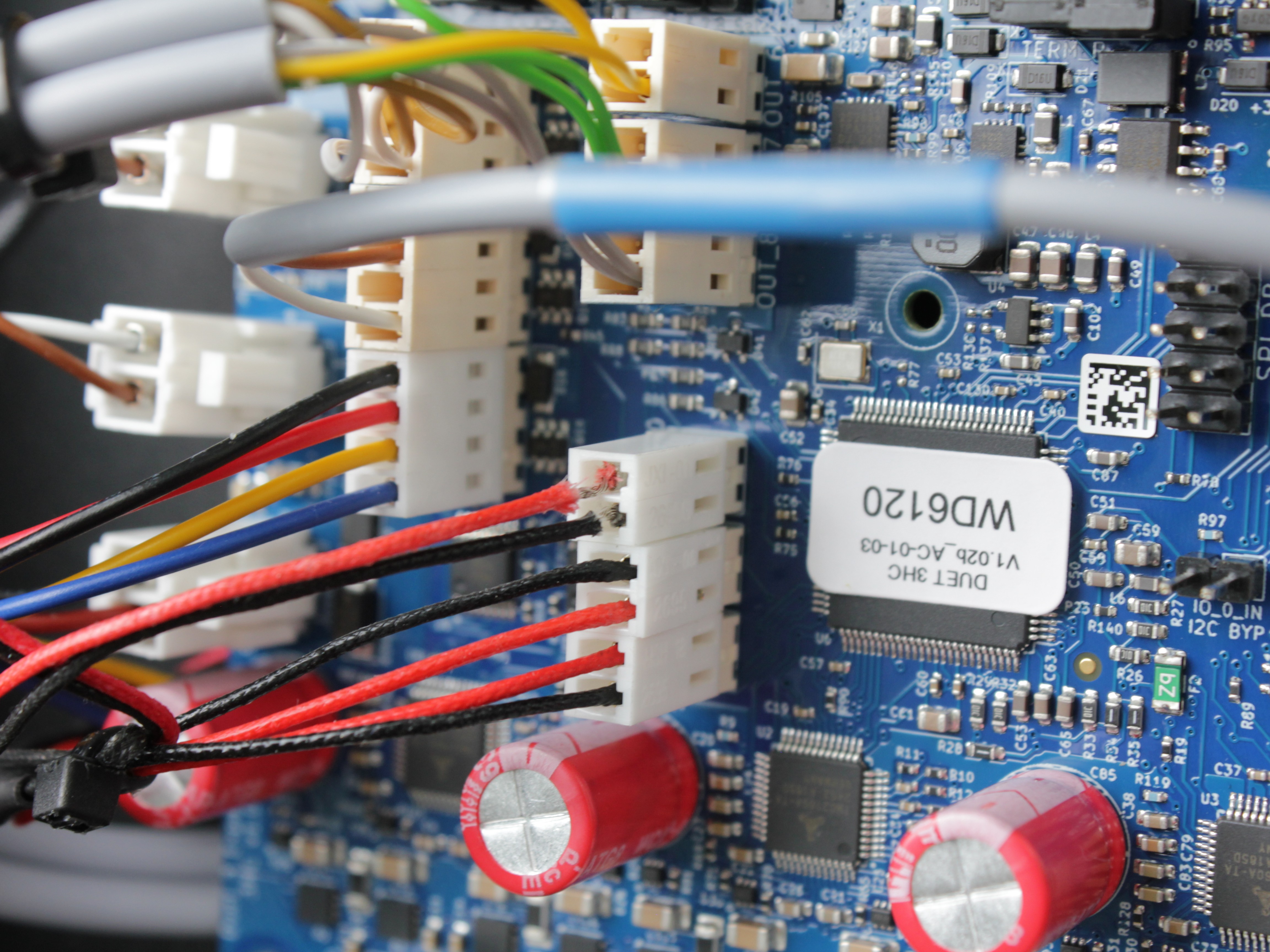 Temperature sensor wire with frayed insulation showing exposed metal