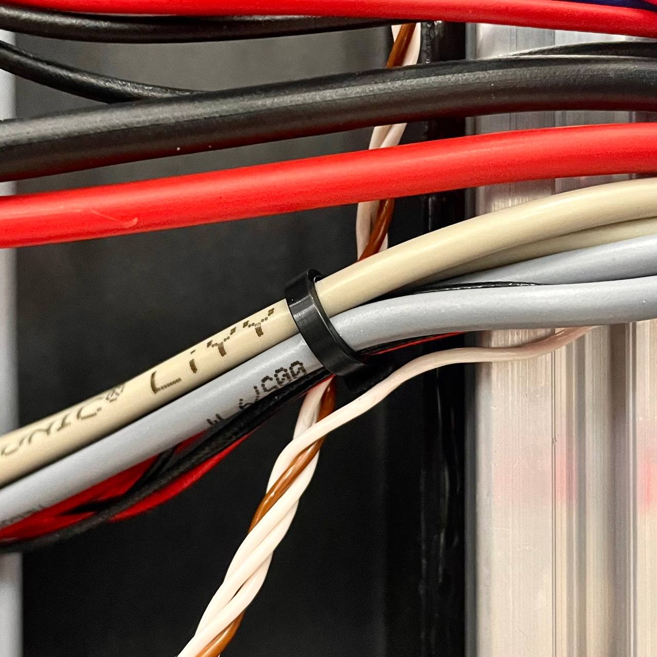 Cutting the zip ties securing the bed sensor cable