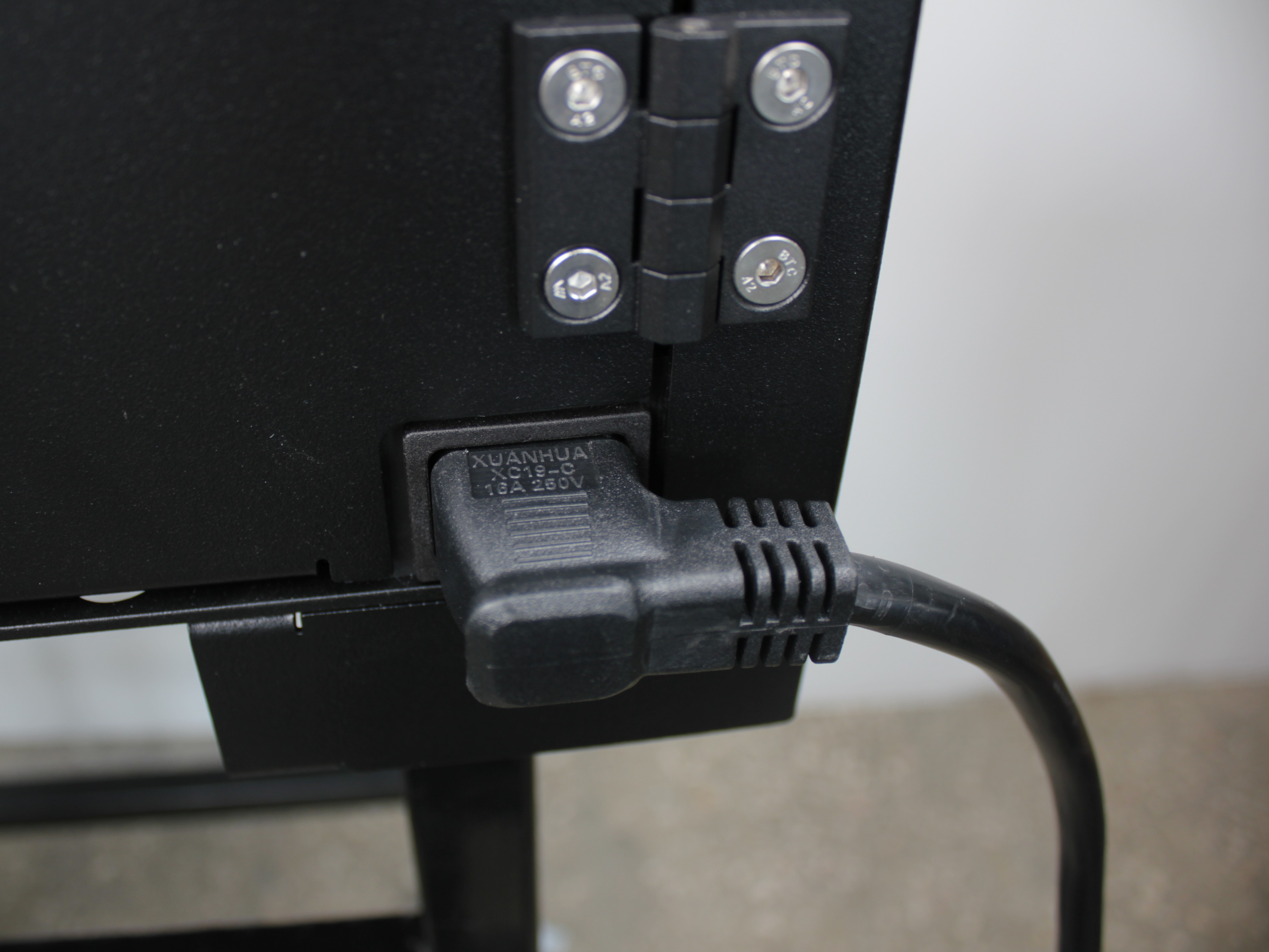 Correct power cable insertion - NEMA 5-15p cable fully inserted into rear panel inlet with no gap visible