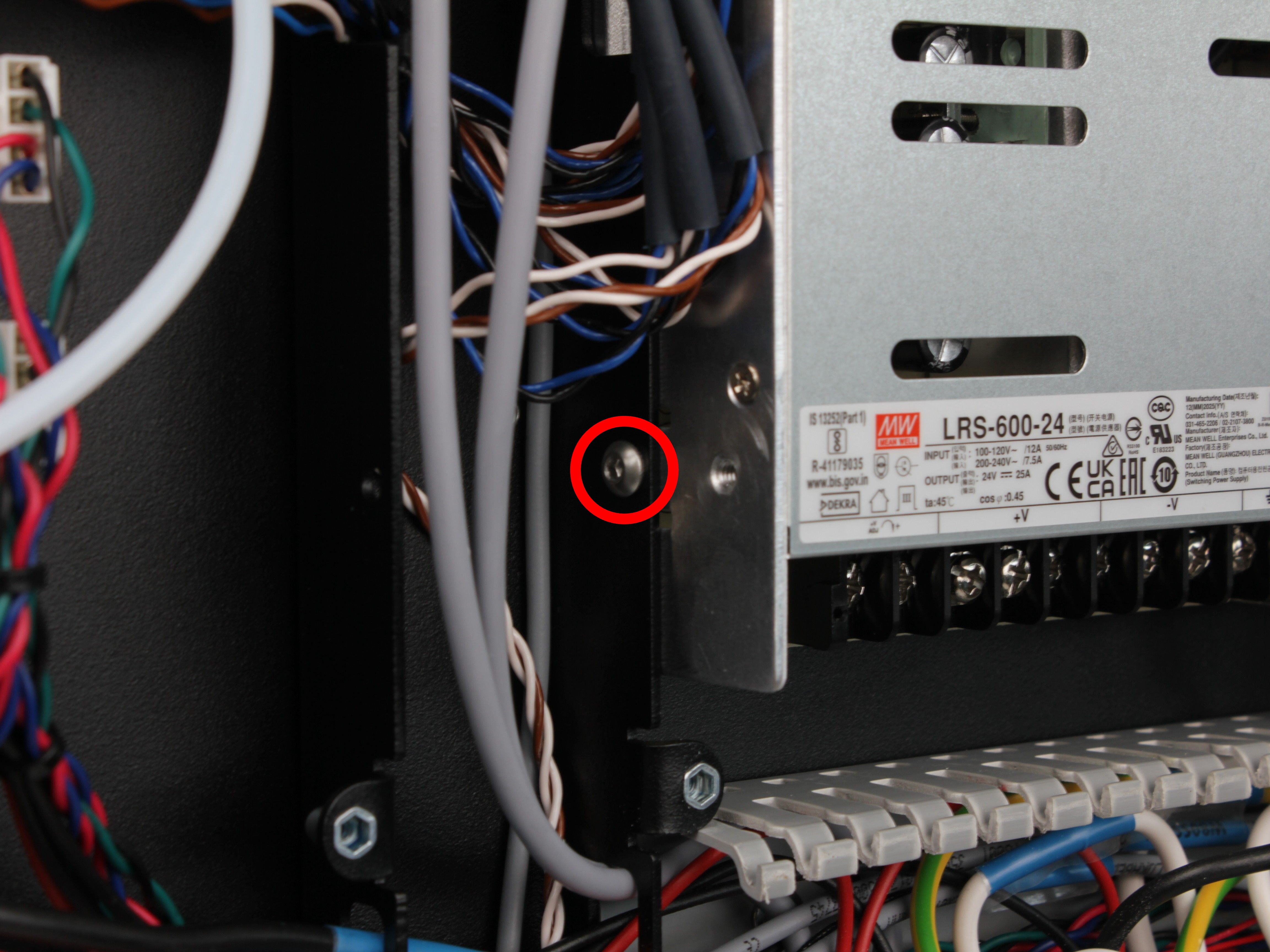 Lower PSU mounting screw on the left side