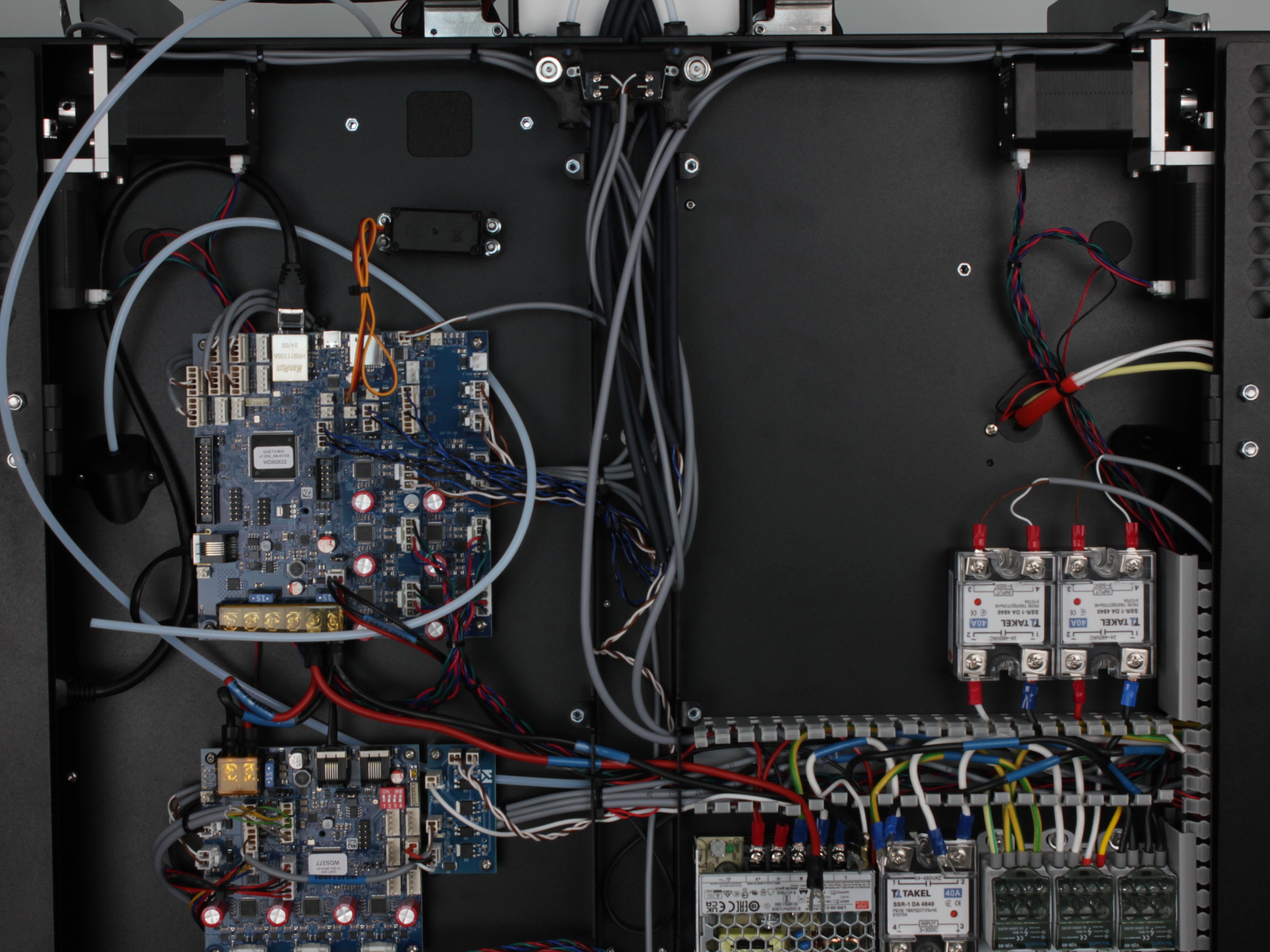 PSU lifted from chassis with L-shaped bracket still attached