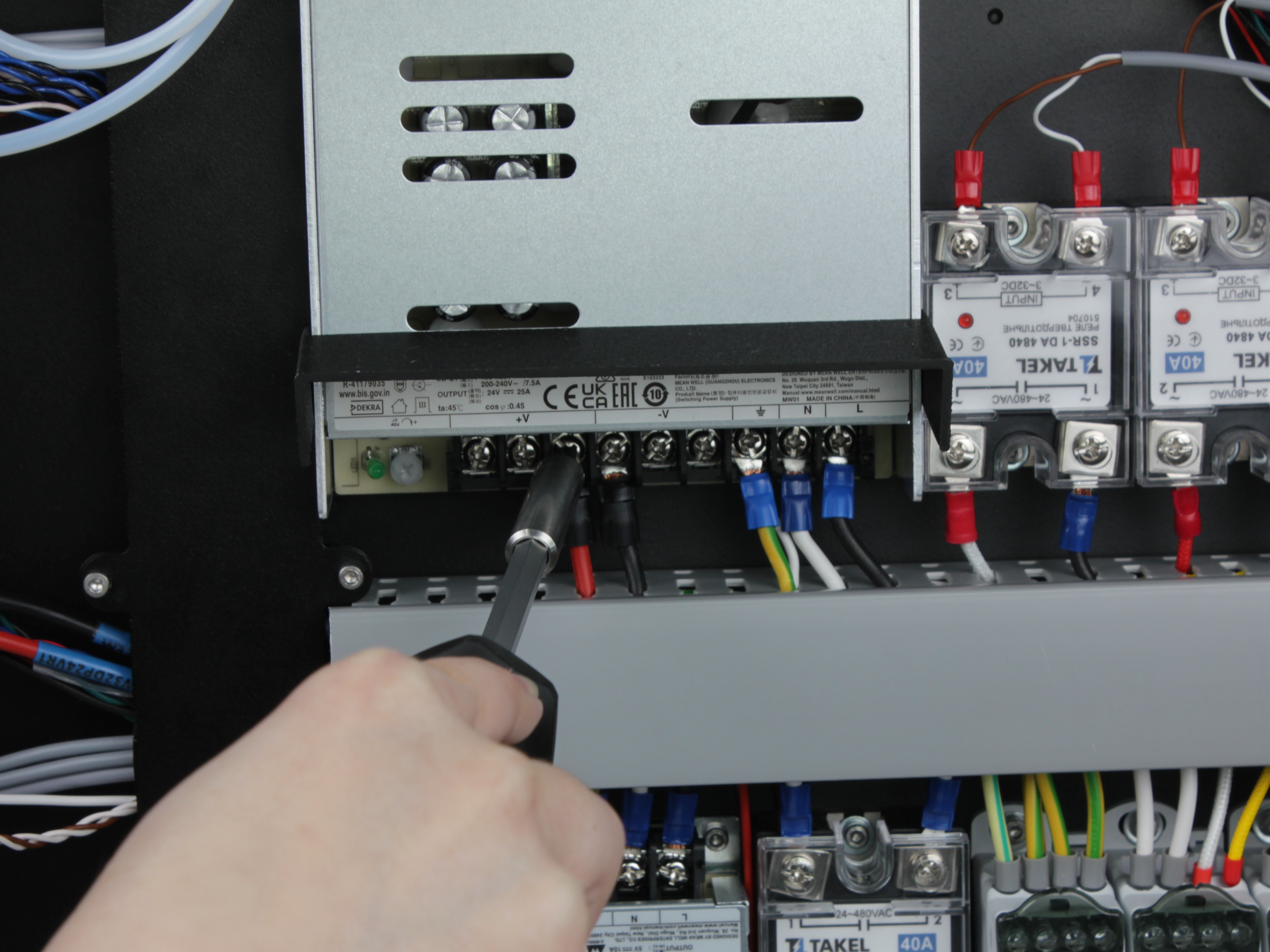 Tightening terminal block screws on power supply example