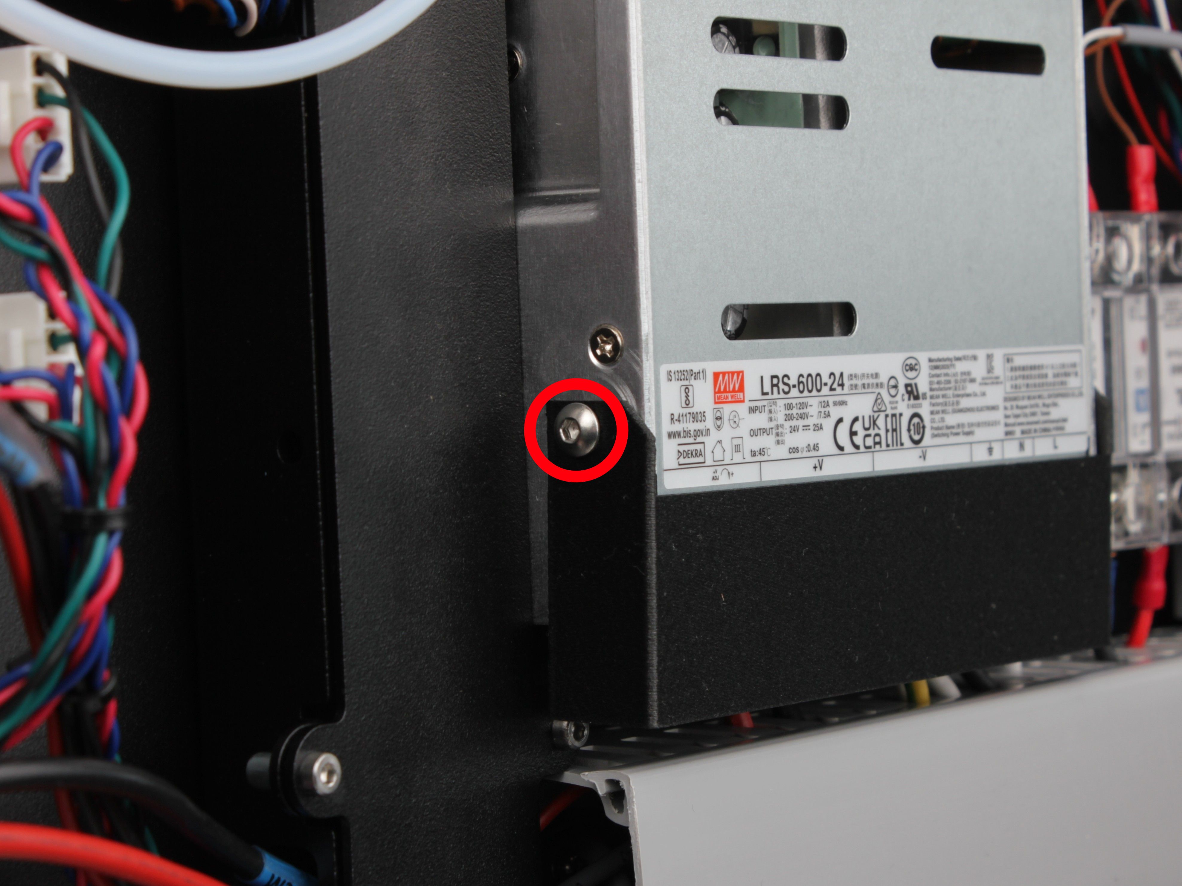 First 2.5 mm hex screw on the 3D-printed PSU terminal cover