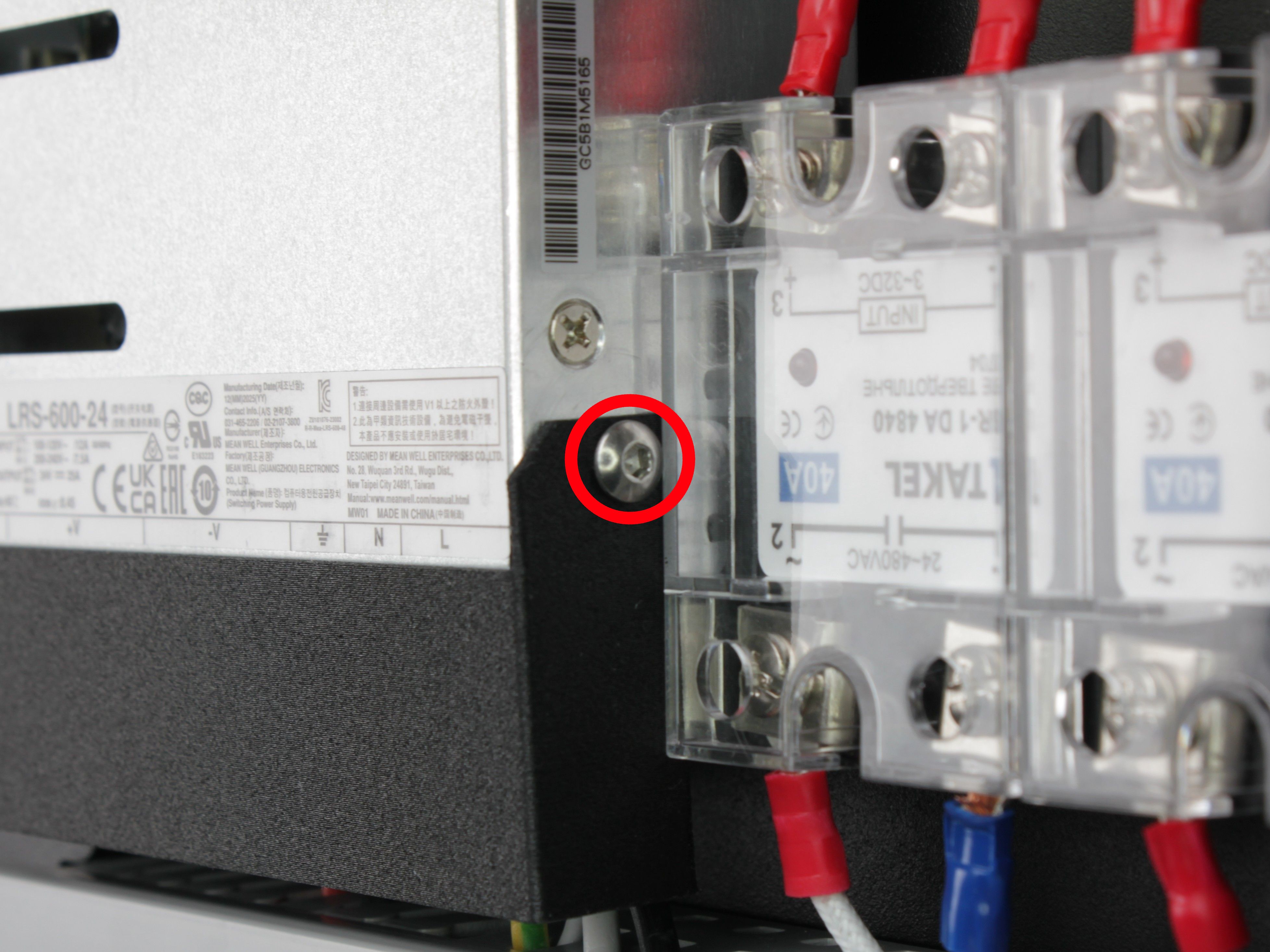 Second 2.5 mm hex screw on the opposite side of the terminal cover