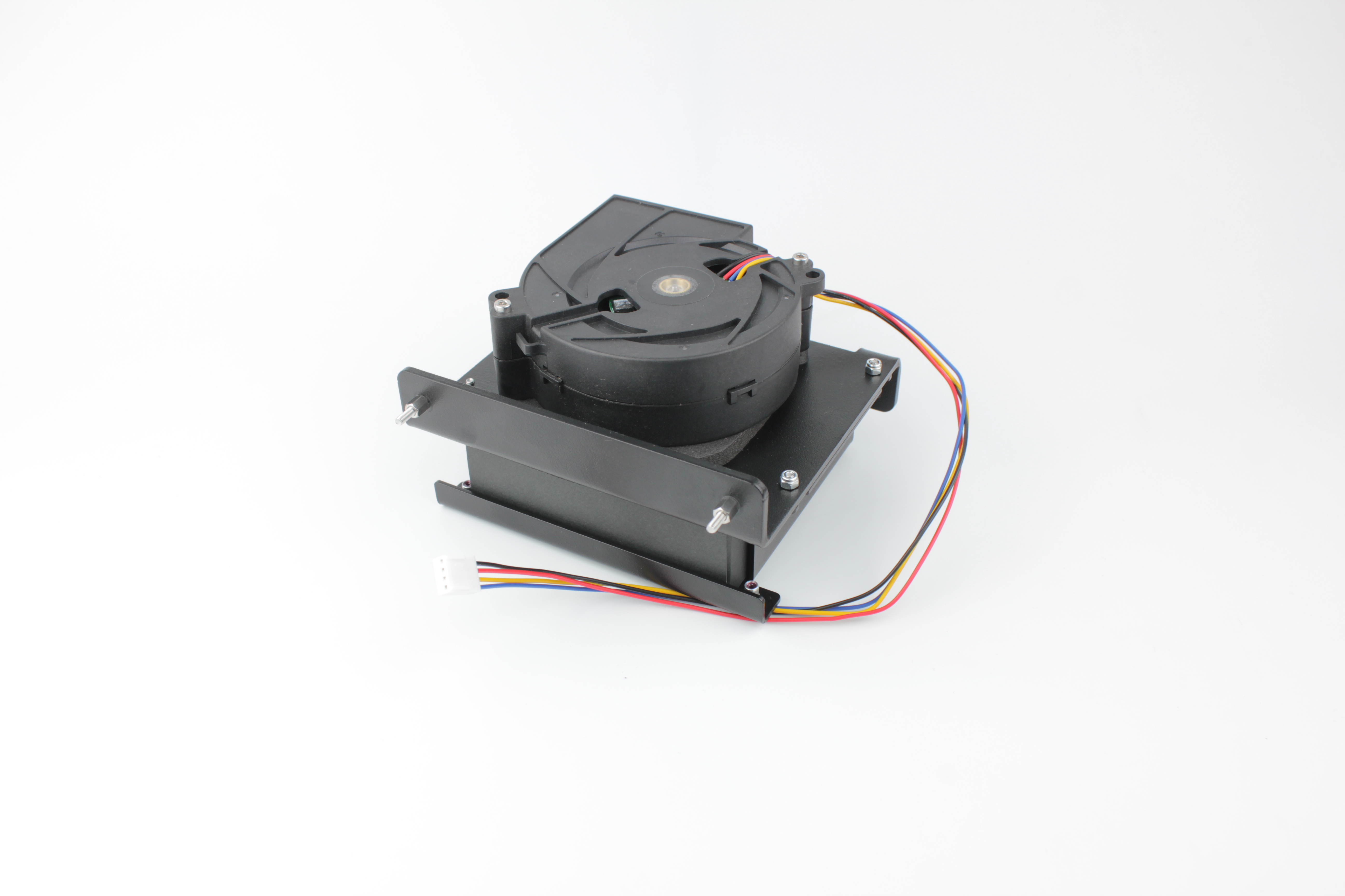 Bracket assembly removed on a clean surface \u2014 bracket, filter, fan