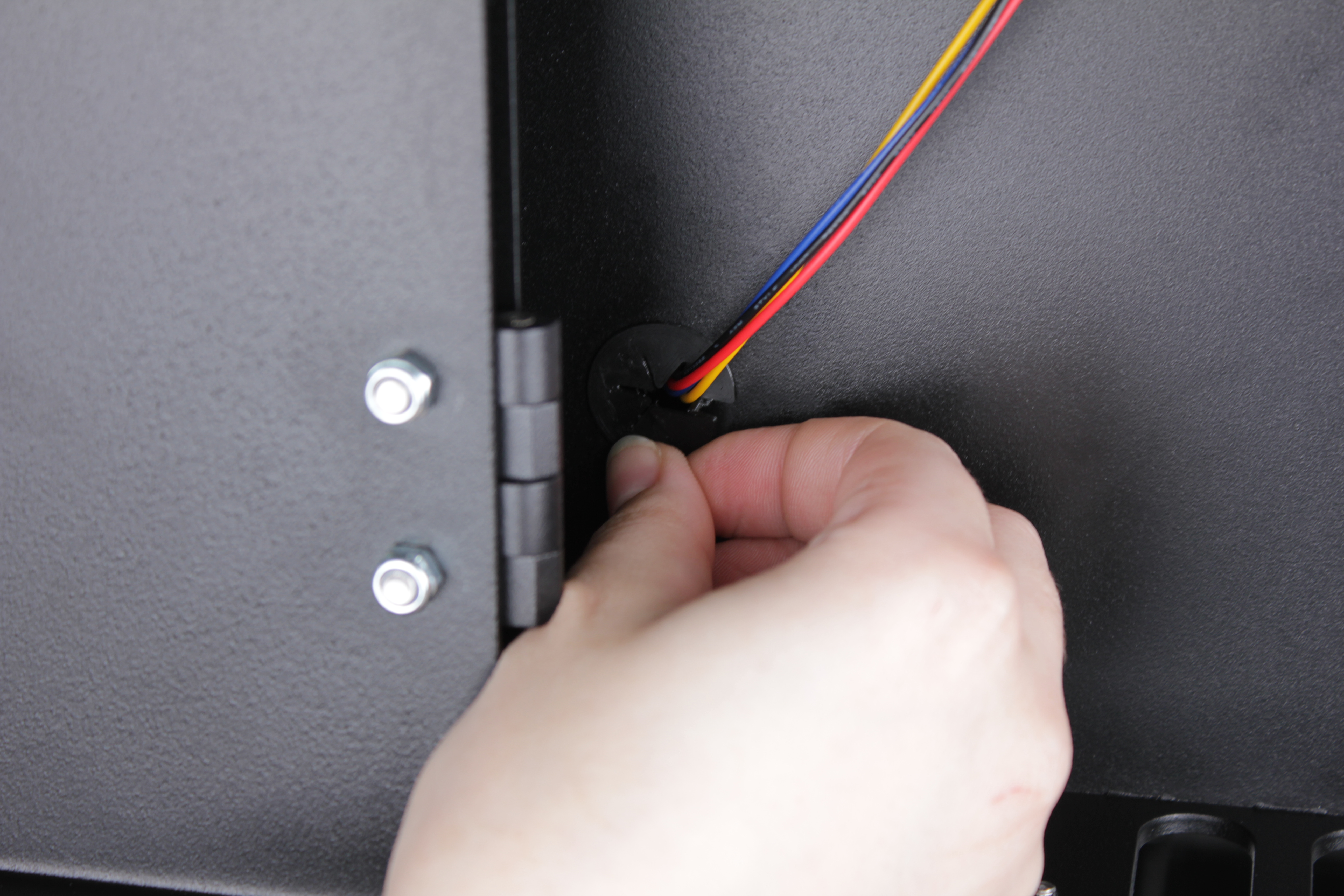 Enclosure wall hole after grommet removal