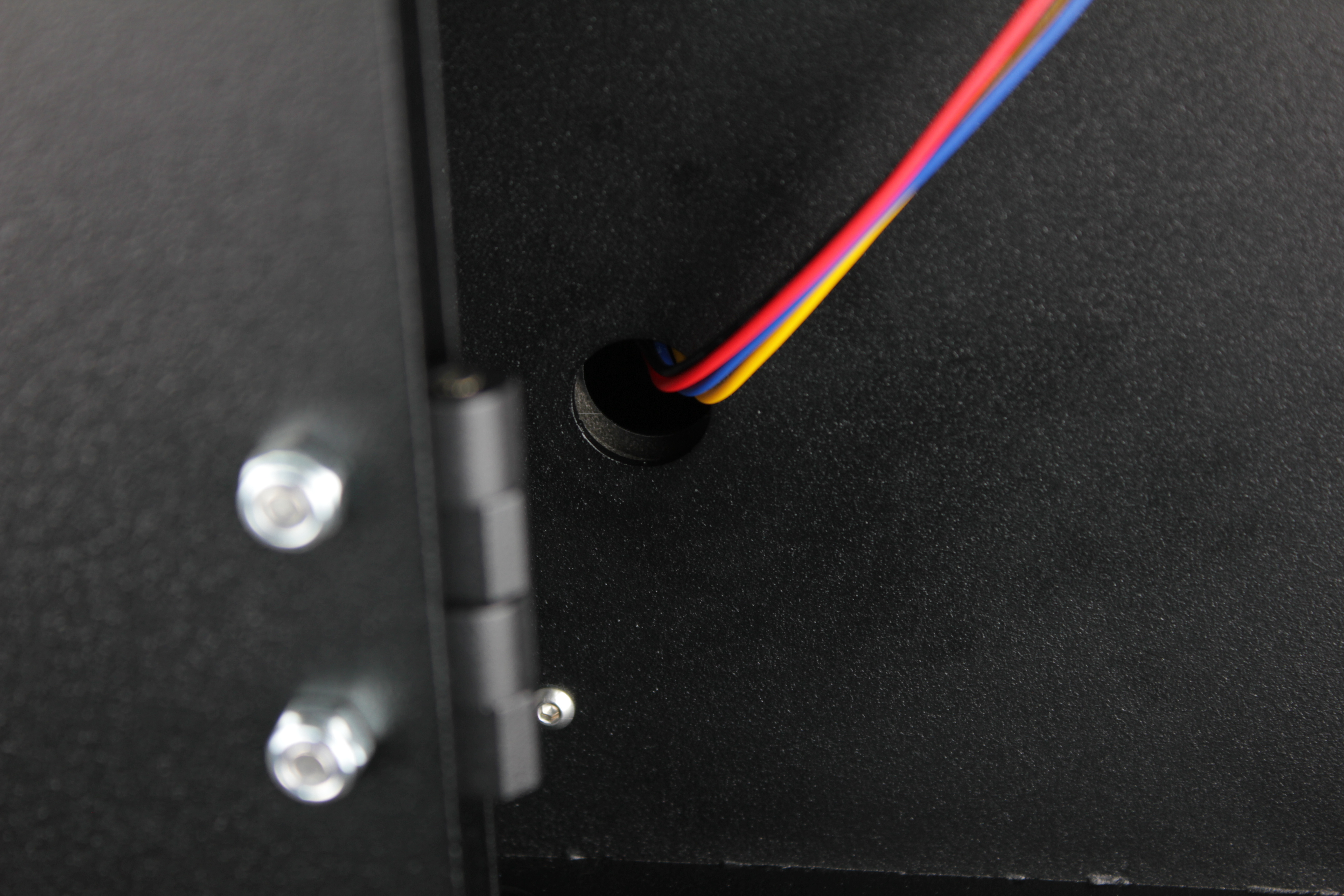 Grommet being pulled out of the enclosure wall hole