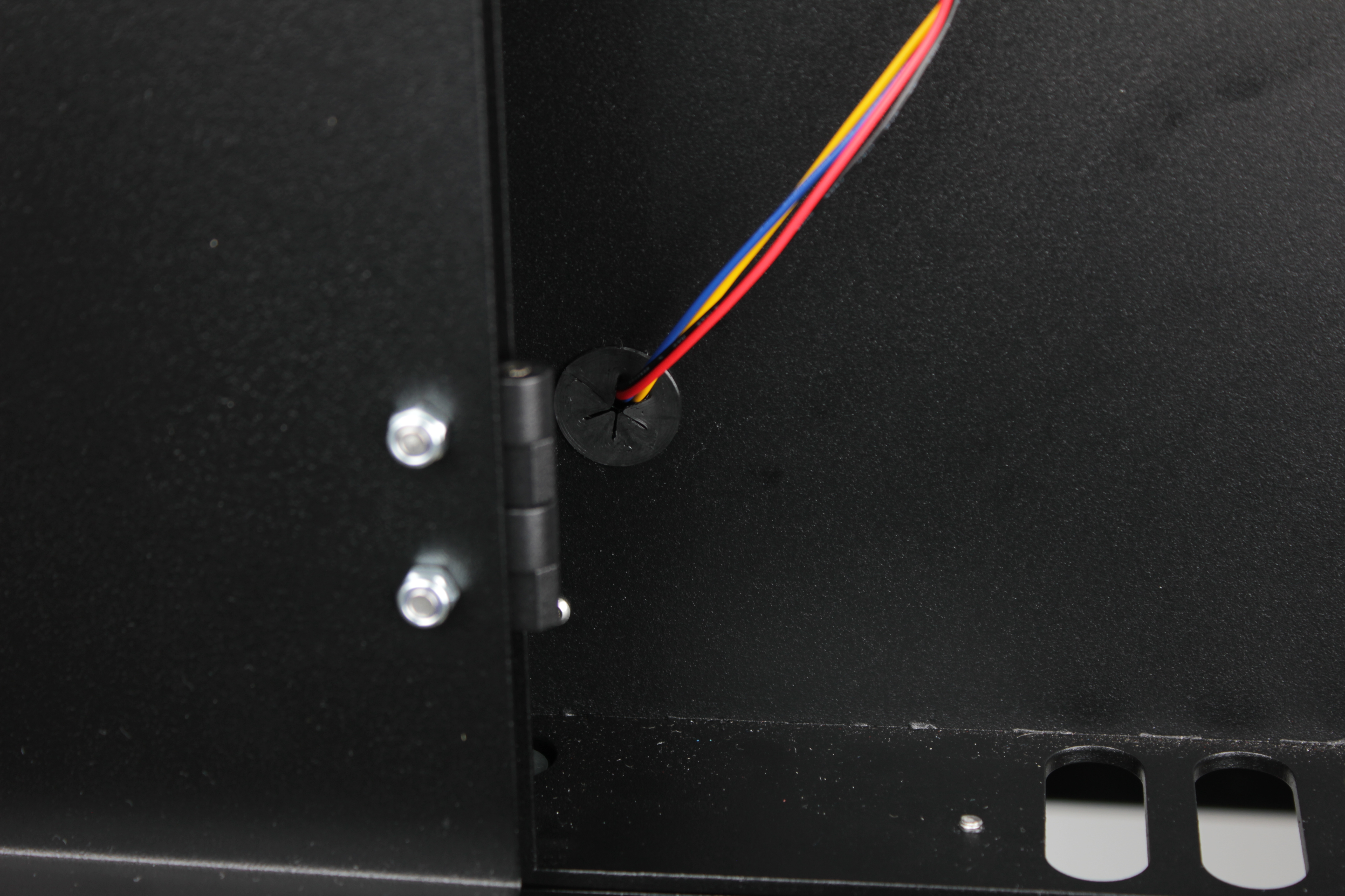 Grommet reinstalled in wall hole with cable sealed