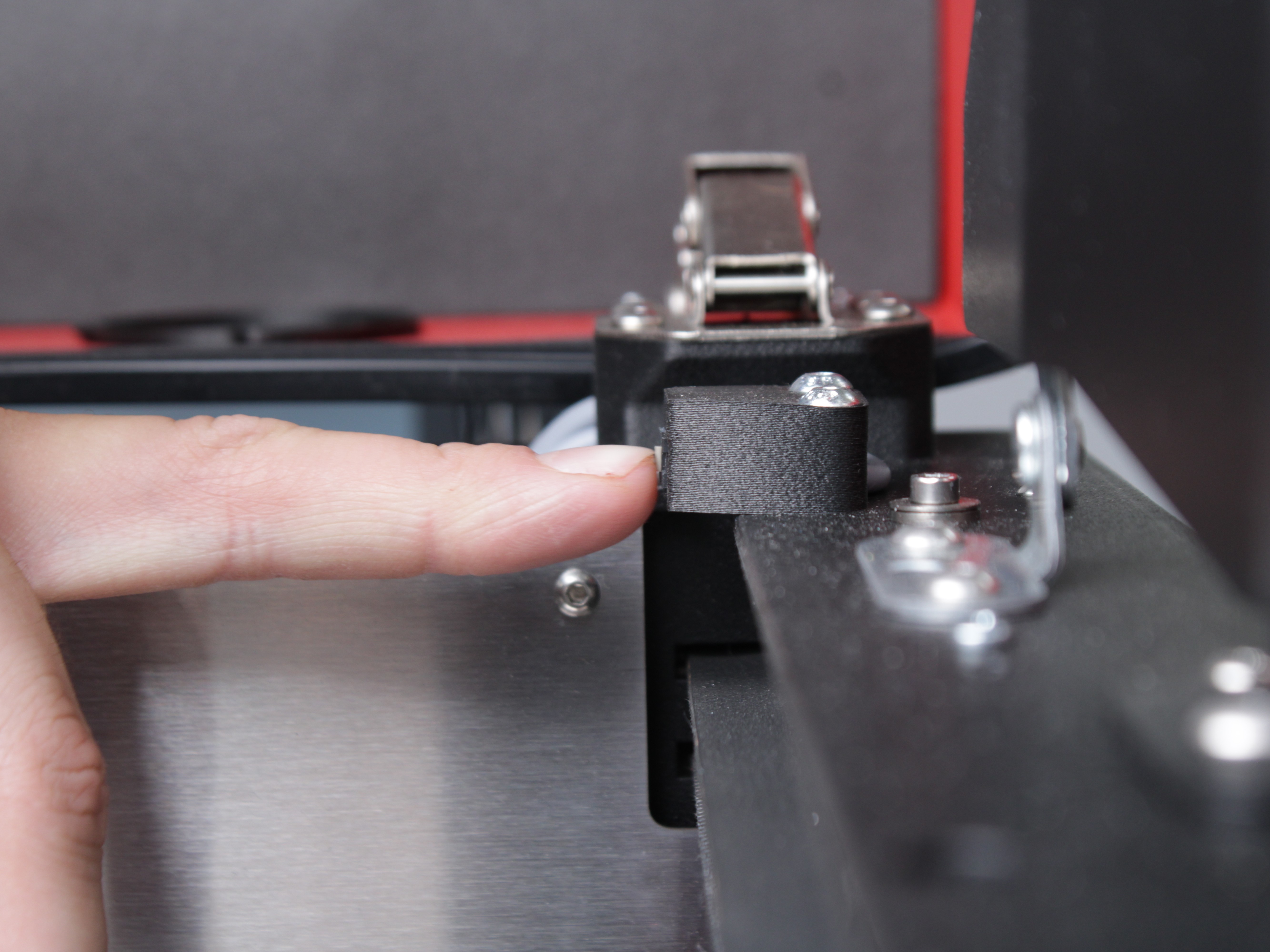 Inspecting endstop switch by pressing it manually.