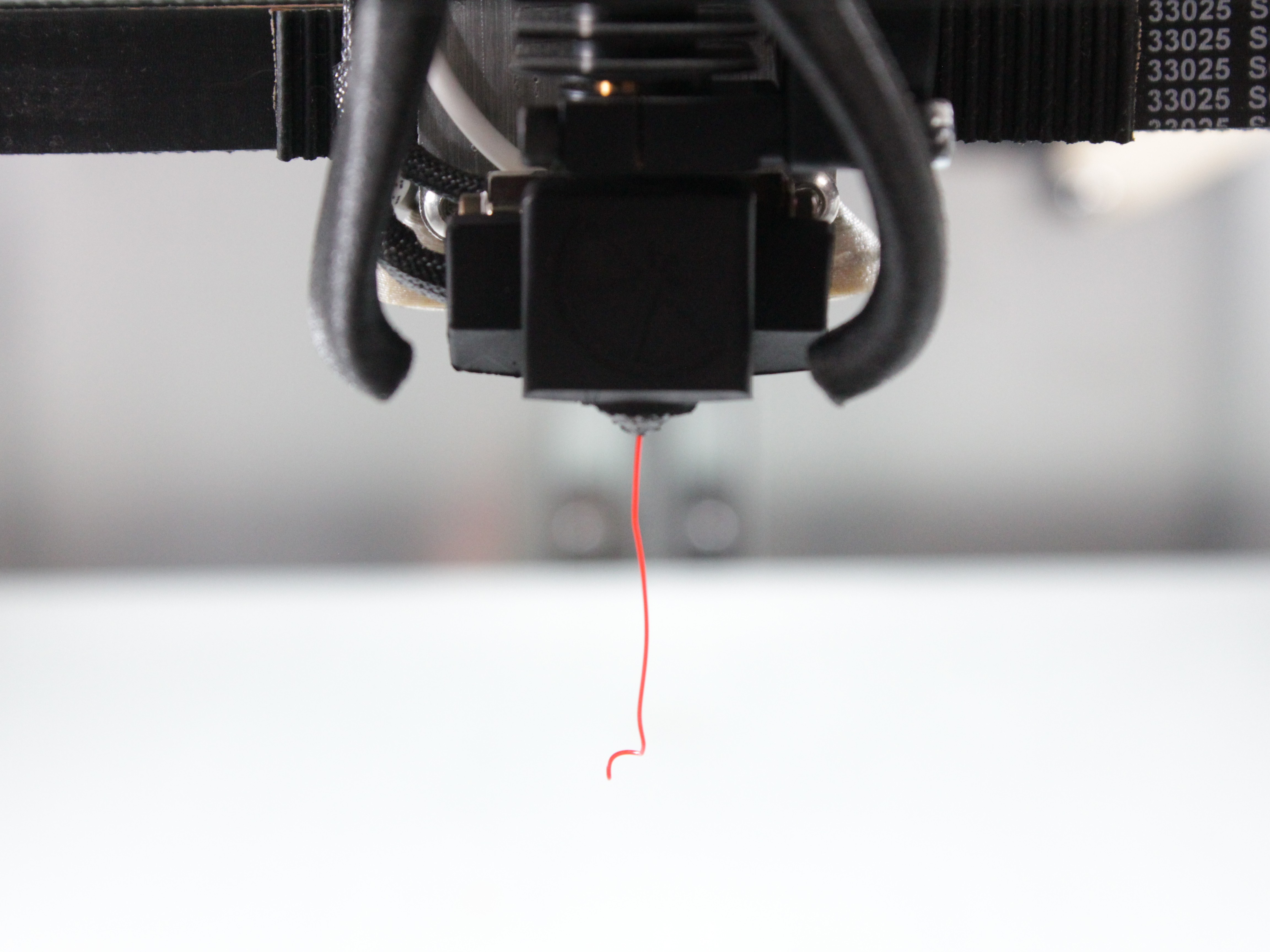 Filament extruding from nozzle confirming successful loading