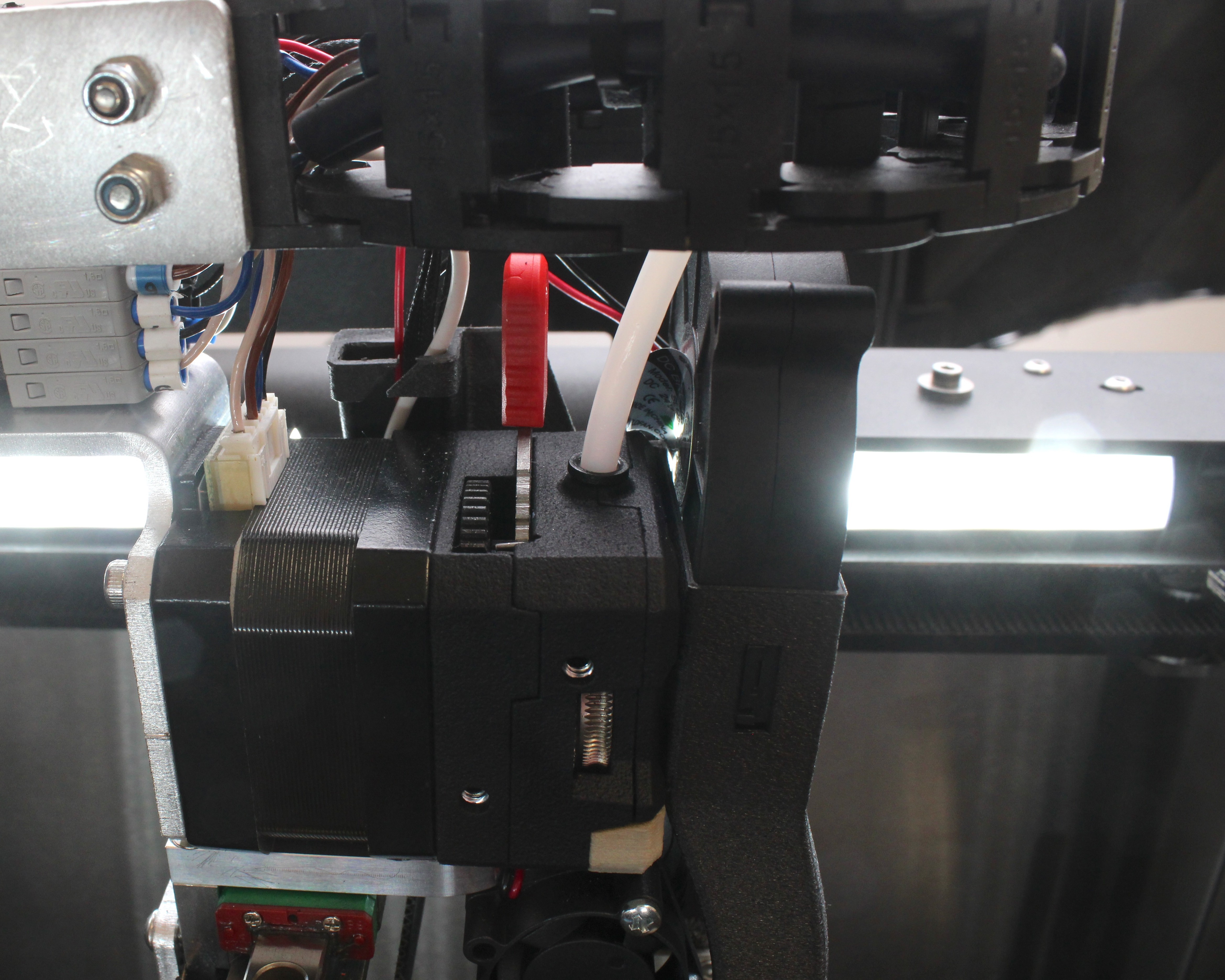 PTFE tube connection at extruder showing push-fit clip.