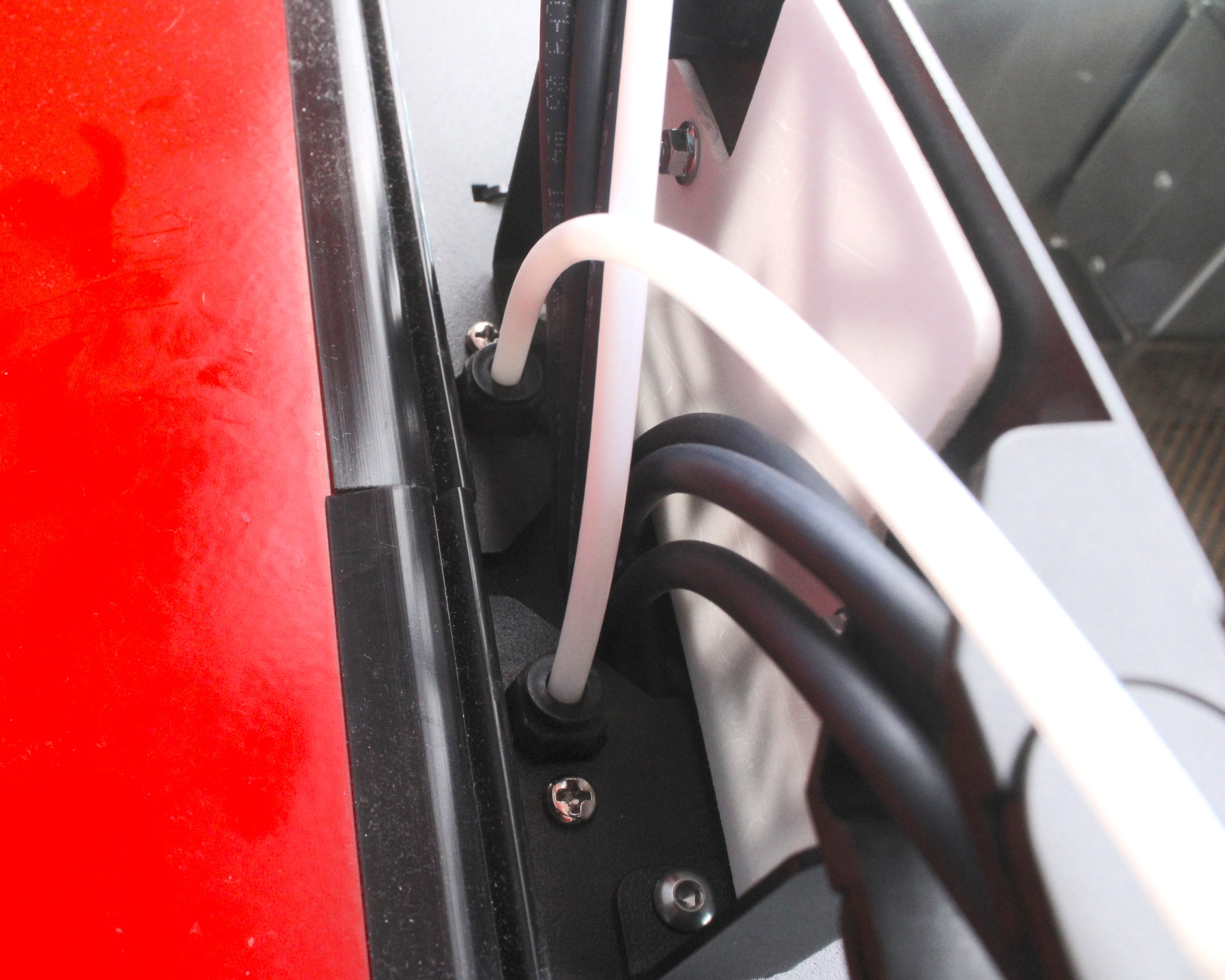 PTFE tube connection at filament sensor mount in upper portal.