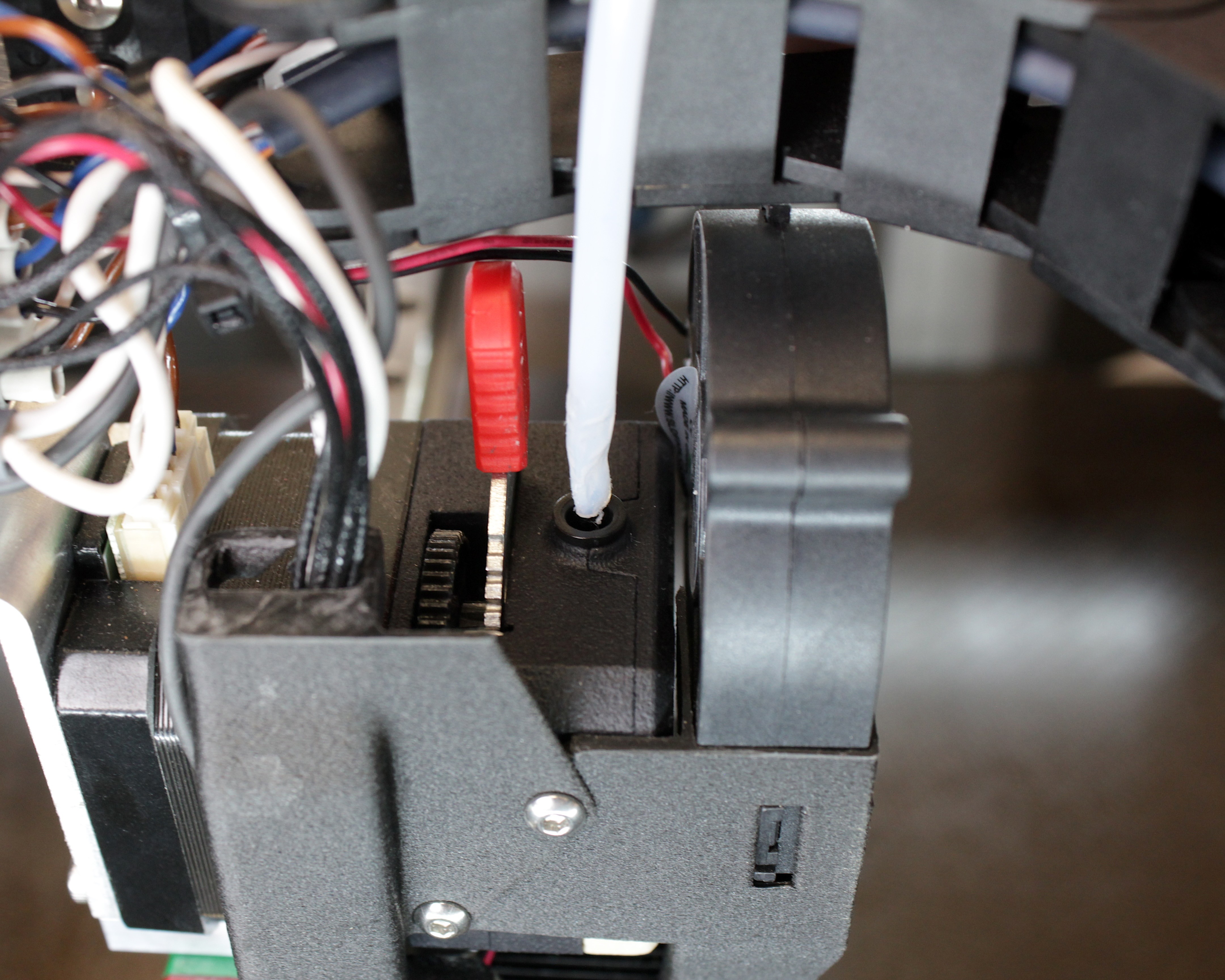 Worn front PTFE tube with a kinked section at the extruder connection.