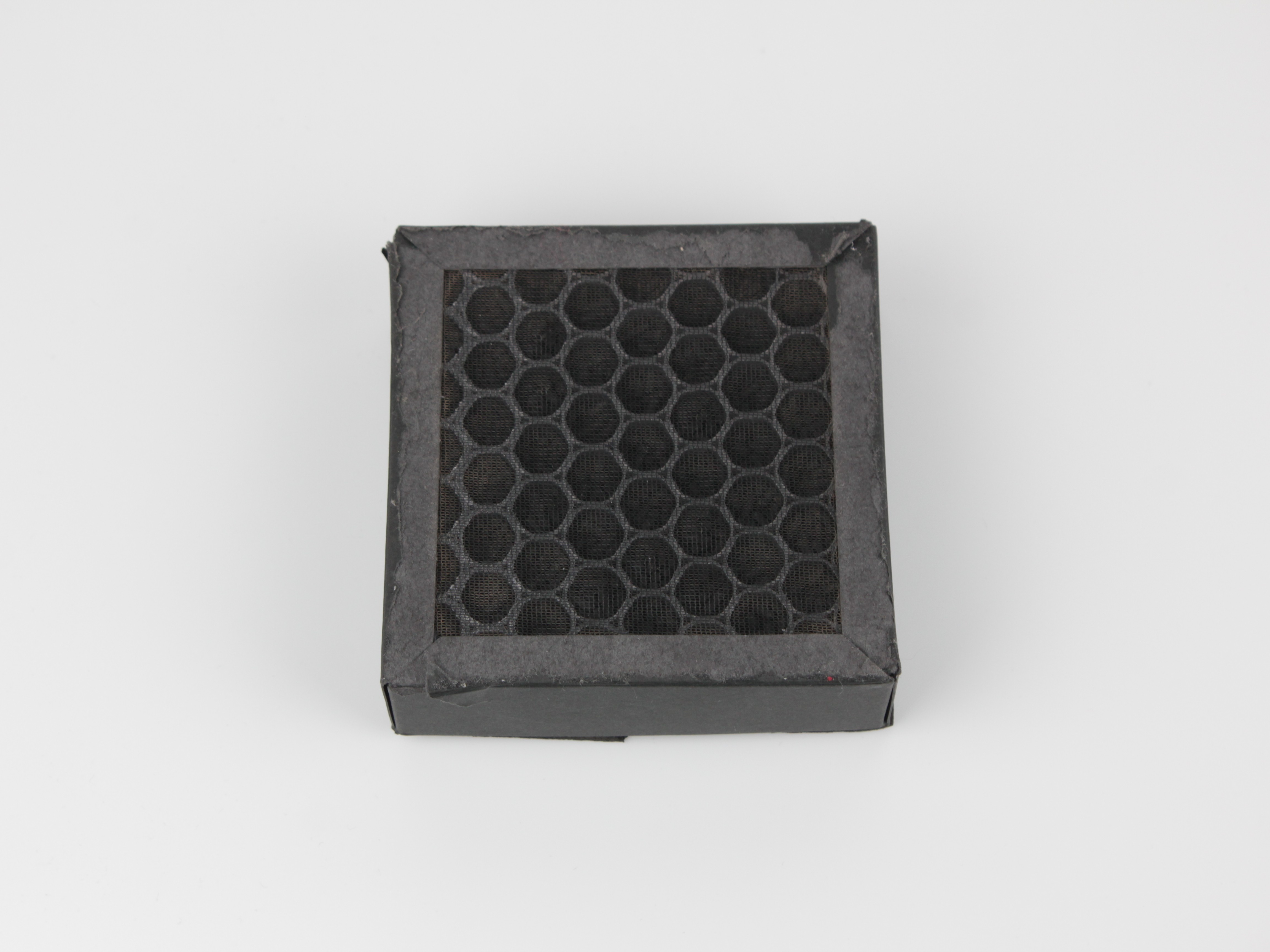 HEPA filter showing carbon honeycomb intake side.