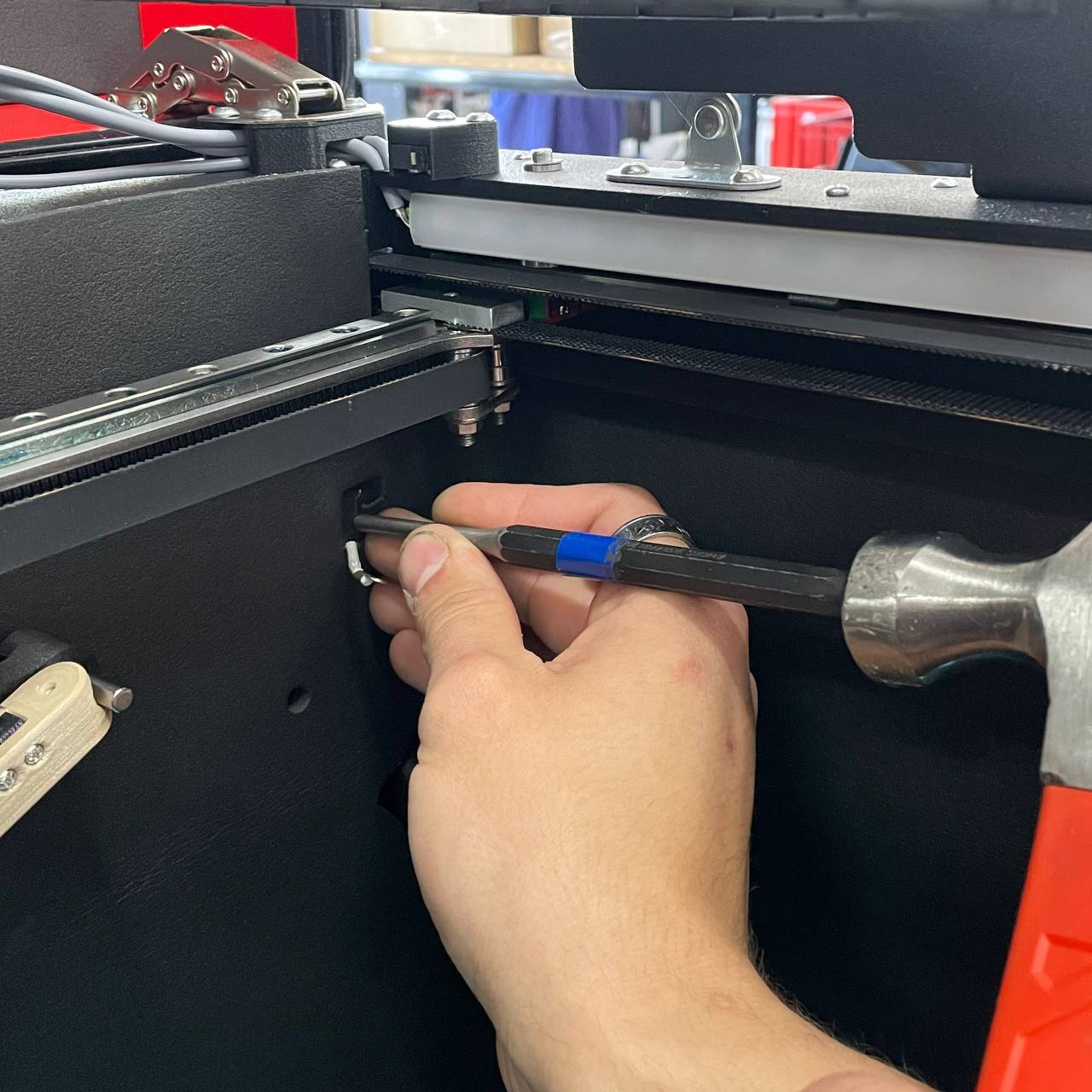 Pushing the printed sensor holder out of the chassis with a punch
