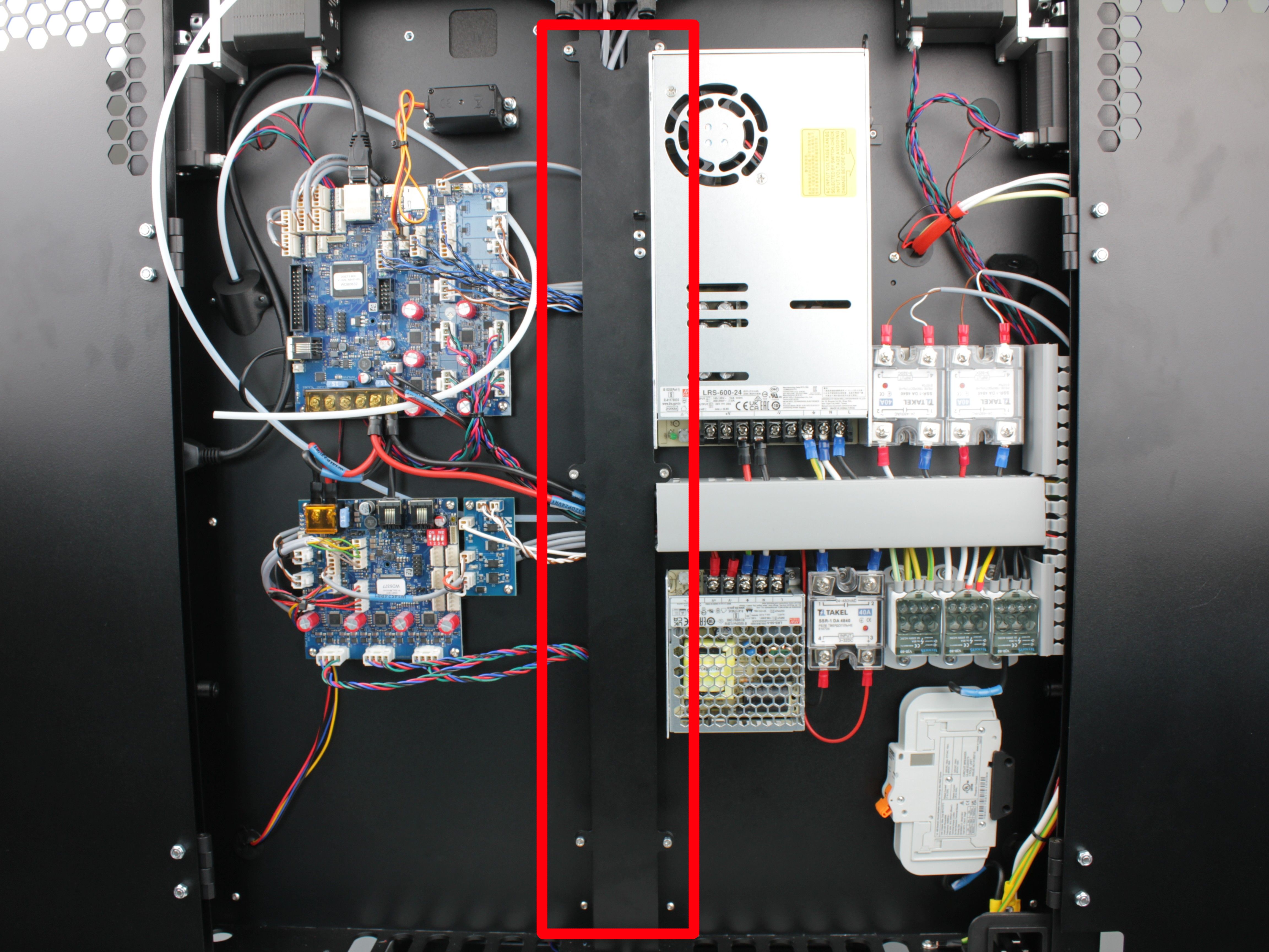 Vertical metal cable channel cover on the left of the PSU