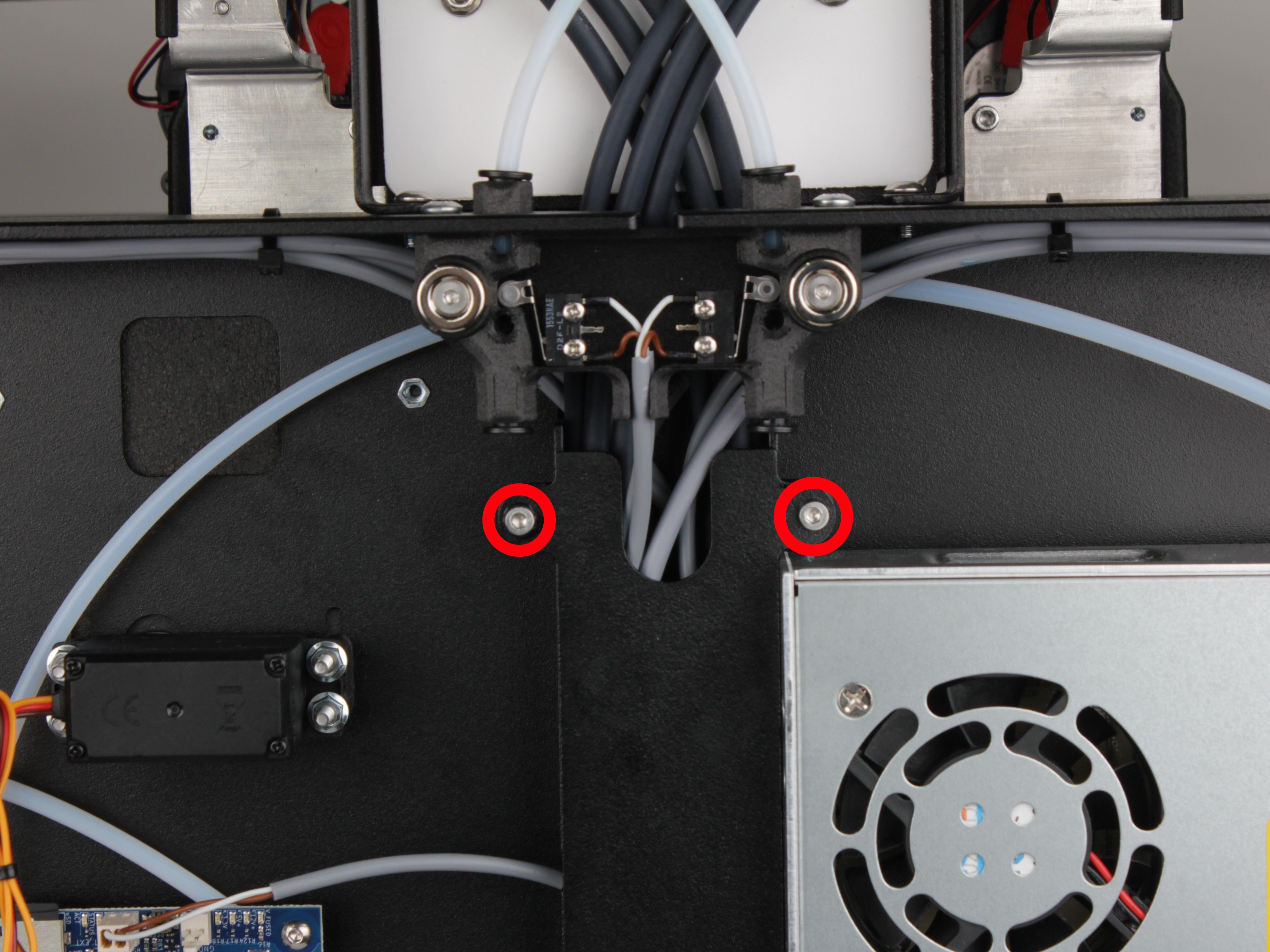 Upper screws on the vertical cable channel cover