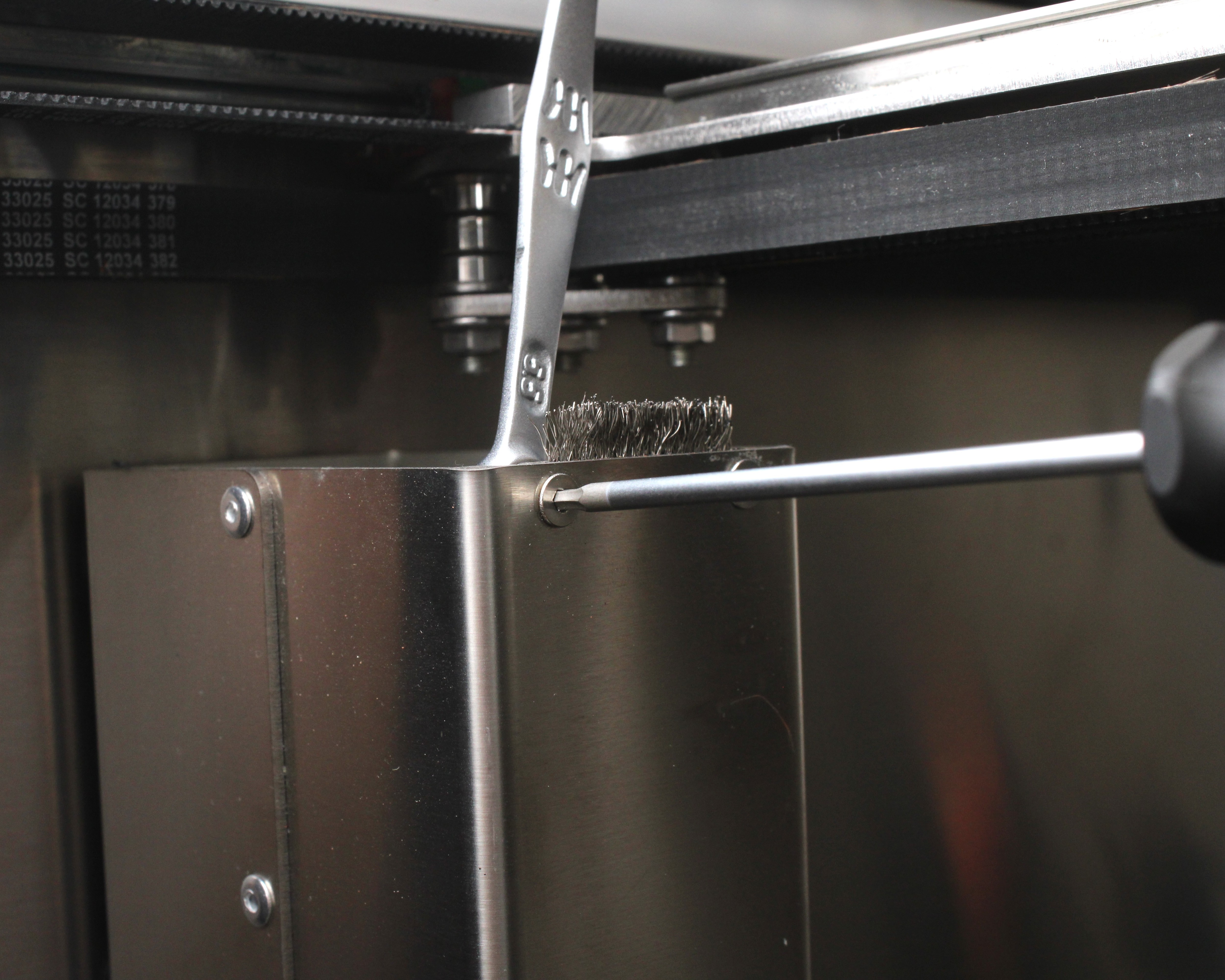 Purge brush mounting screws to loosen before height adjustment