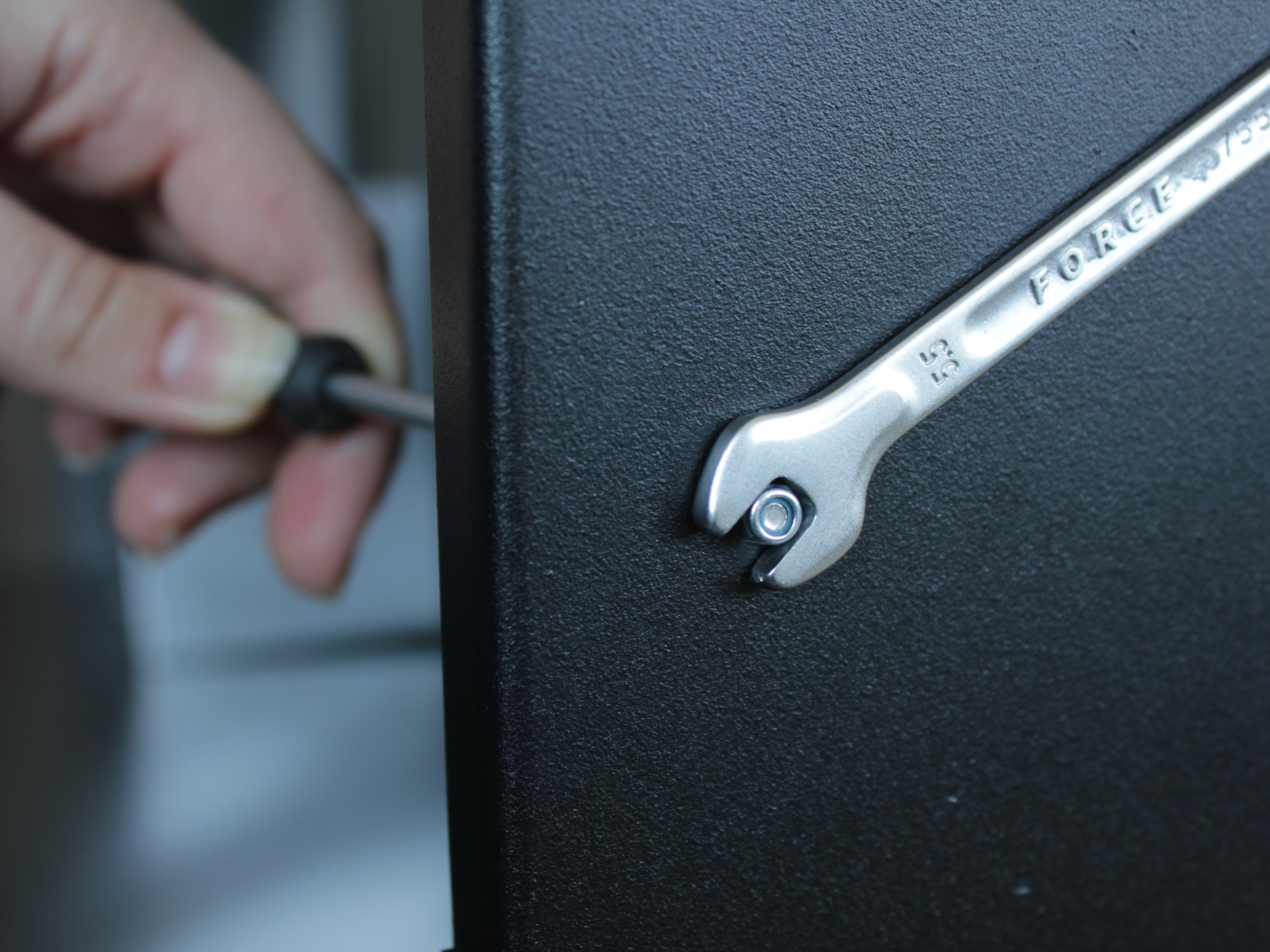 Front Z-rail mounting point with old nut - using 5.5mm wrench