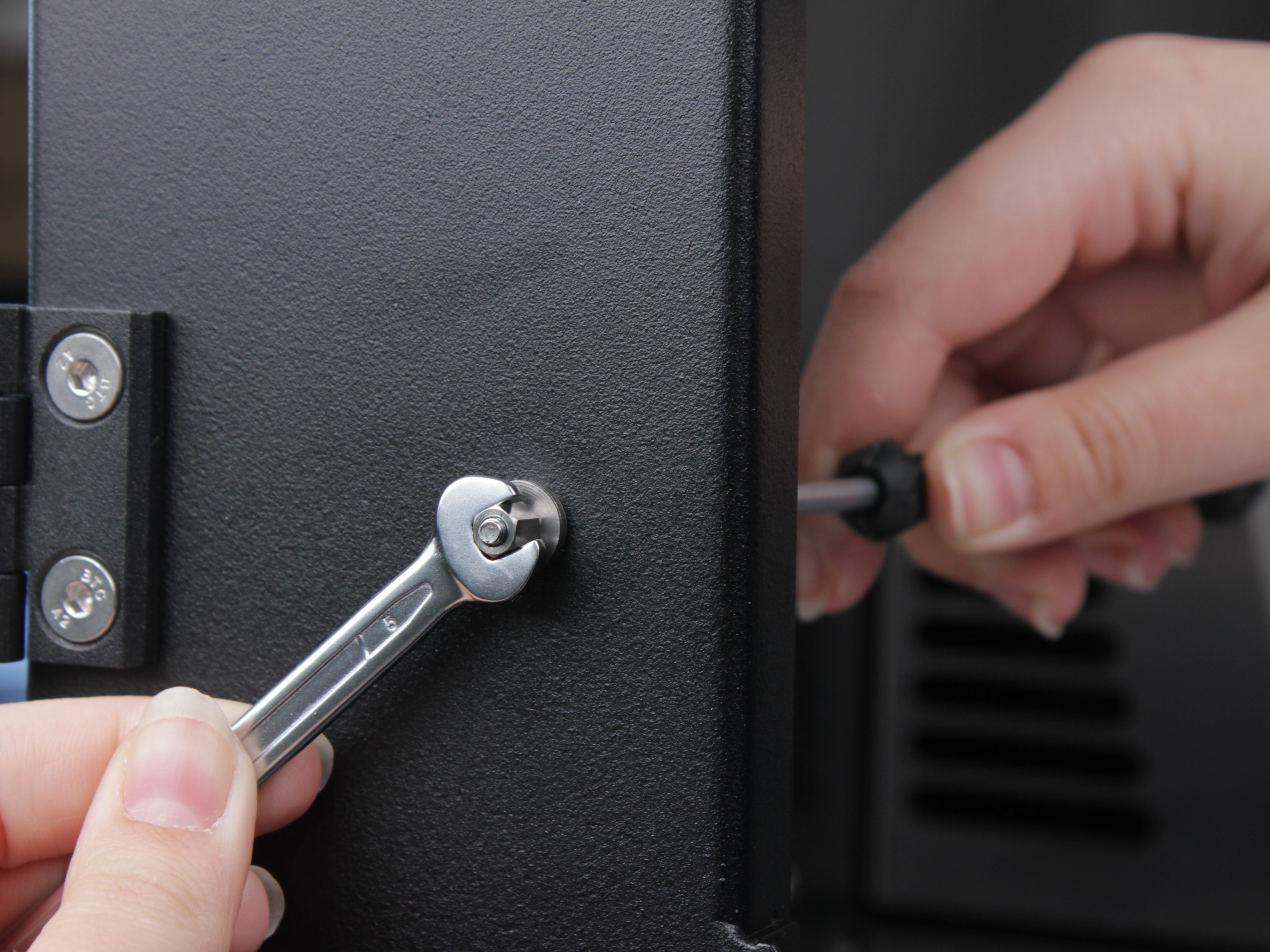 Tightening standoff with 5mm wrench and 2.5mm hex screwdriver