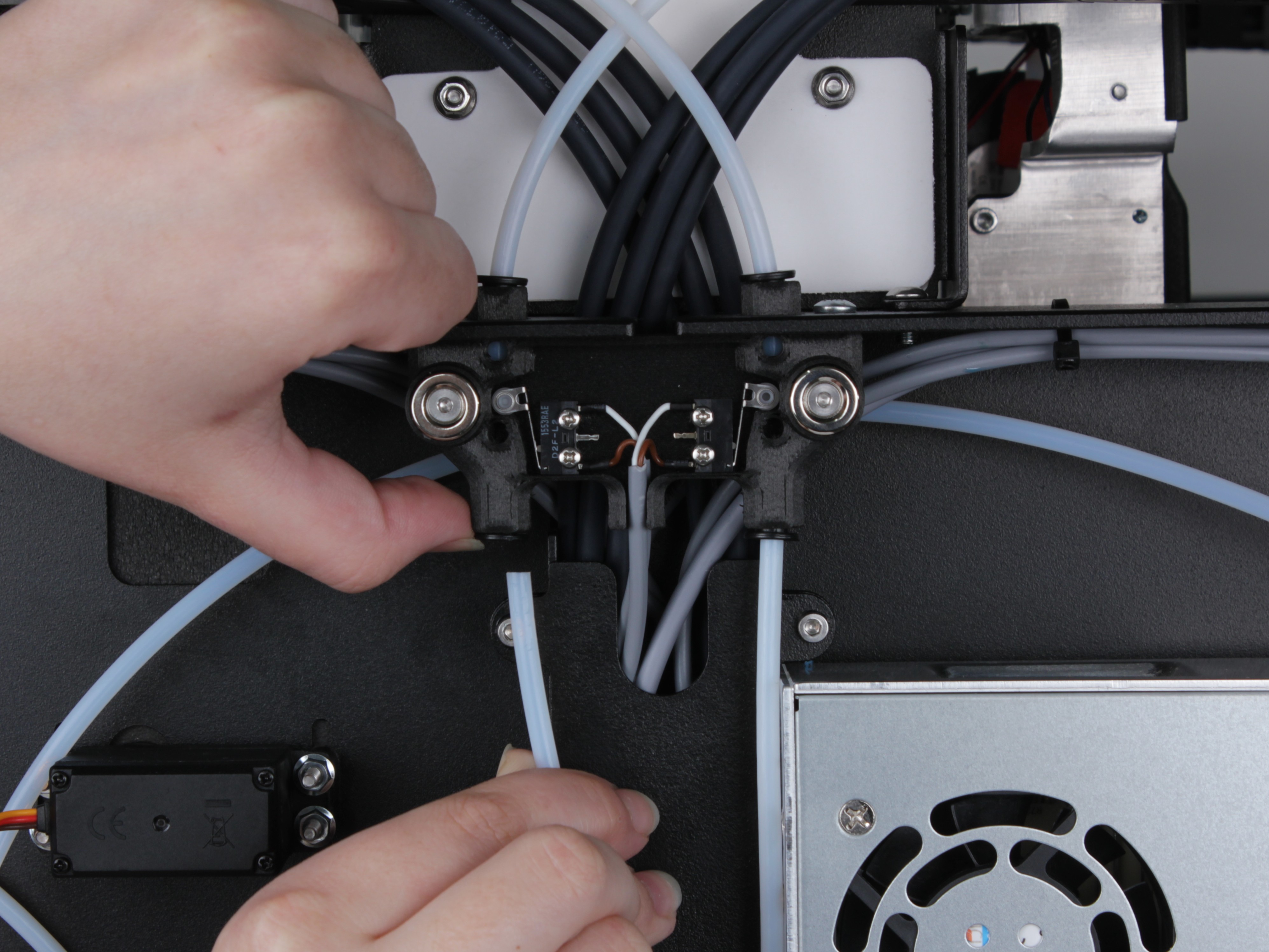 Both PTFE tubes being removed from the endstop holder