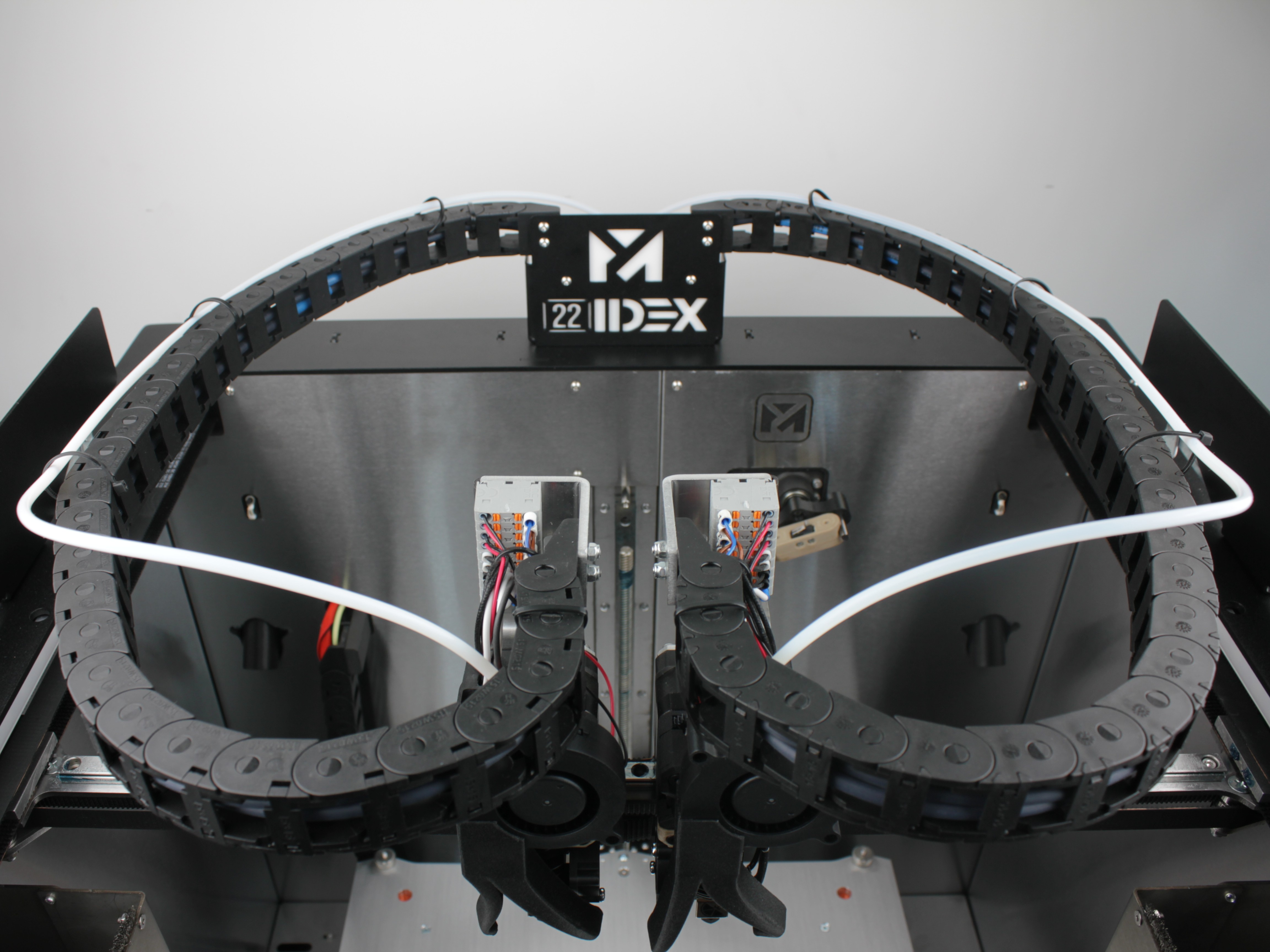 After: Front zip tie removed - the PTFE tube follows a wider, gentler curve near the toolhead