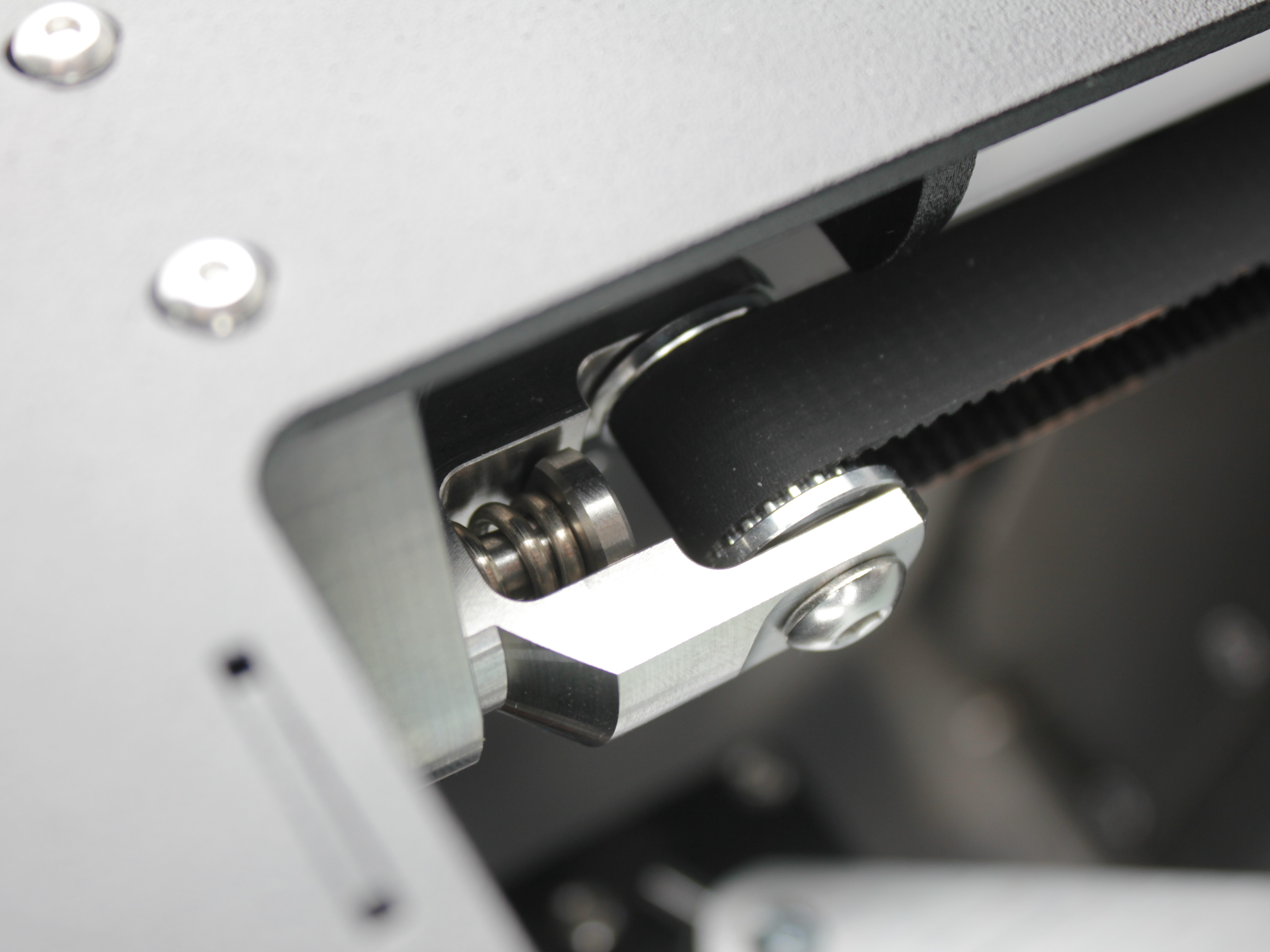 Belt tensioner with stronger spring - serial numbers 296 and above