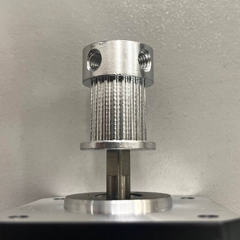 Pulley on new motor shaft with D-cut aligned to set screw.