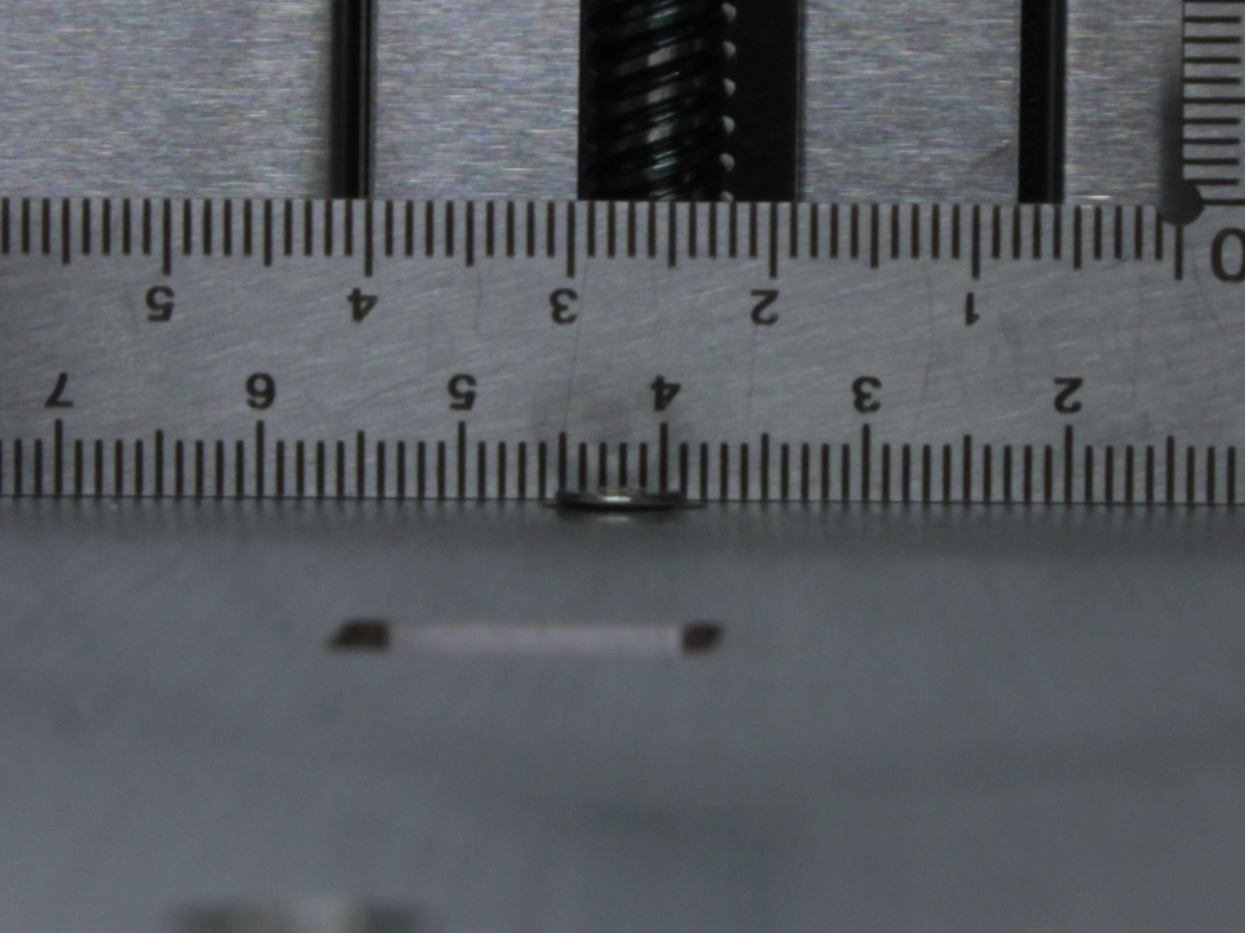 Incorrect: the rear screw protrudes above the bed surface. This will push the build plate up and distort the bed mesh height map.