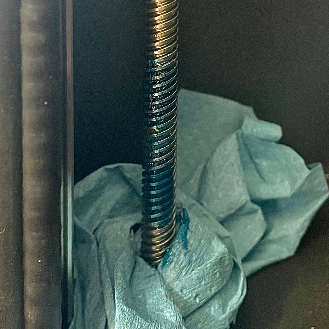 Applying high-temperature grease to the lower portion of Z-axis lead screw