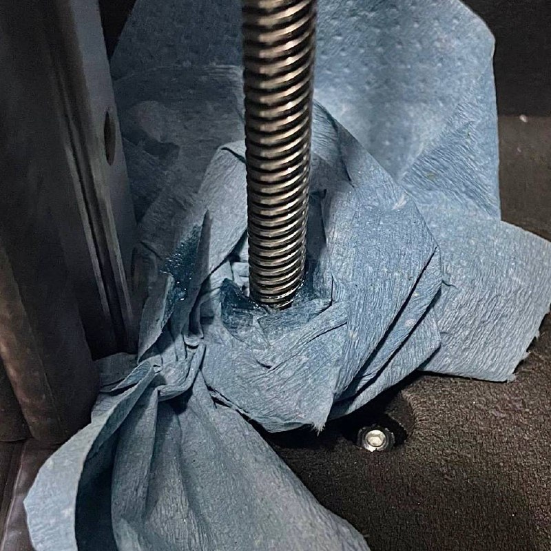 Z-axis lead screws with old grease and debris before cleaning