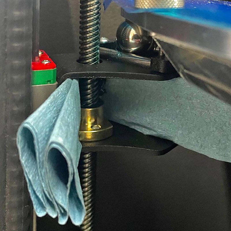 Clean Z-axis lead screws after wiping down
