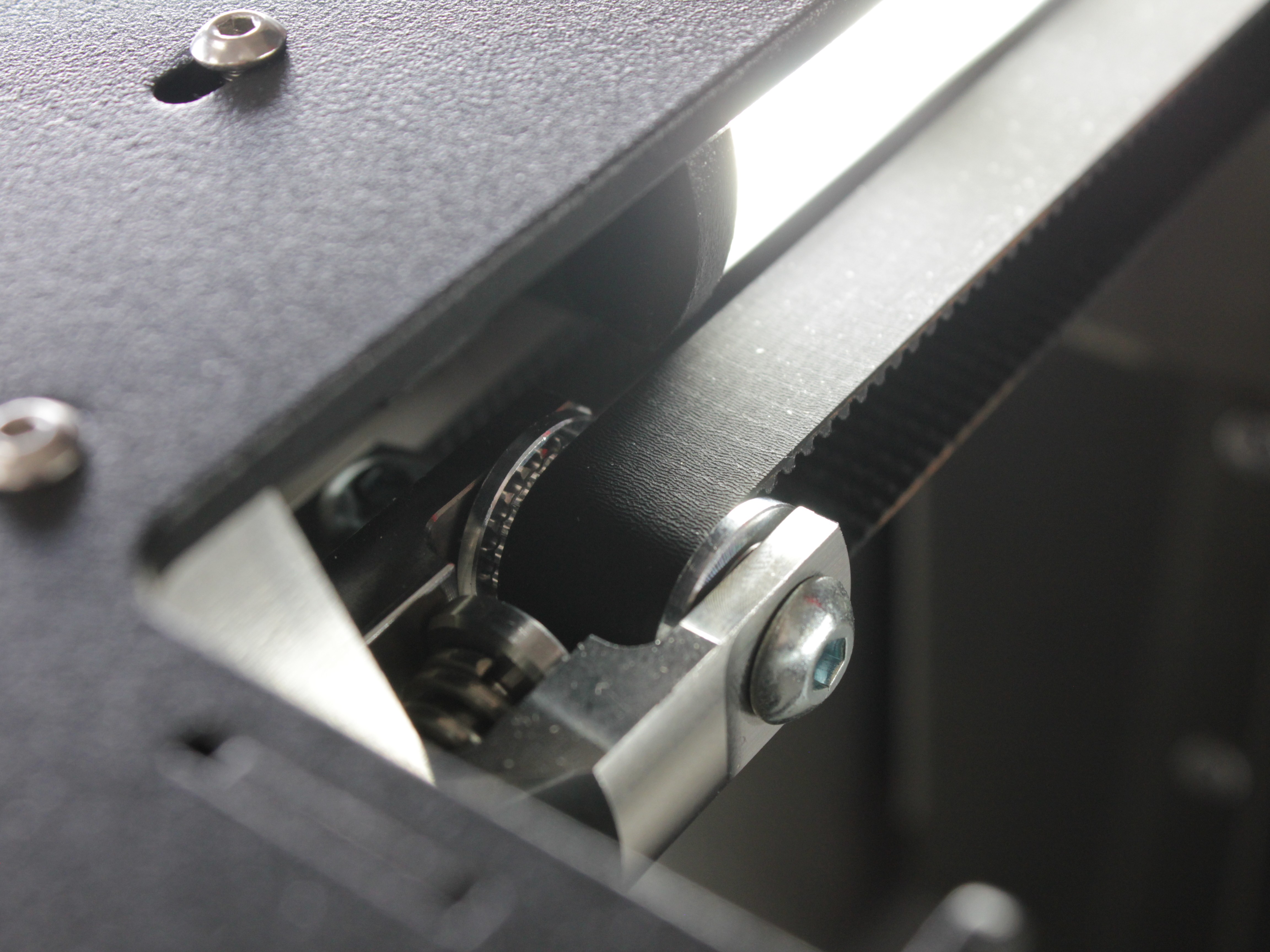 Y-axis belt tensioner idler with bearing
