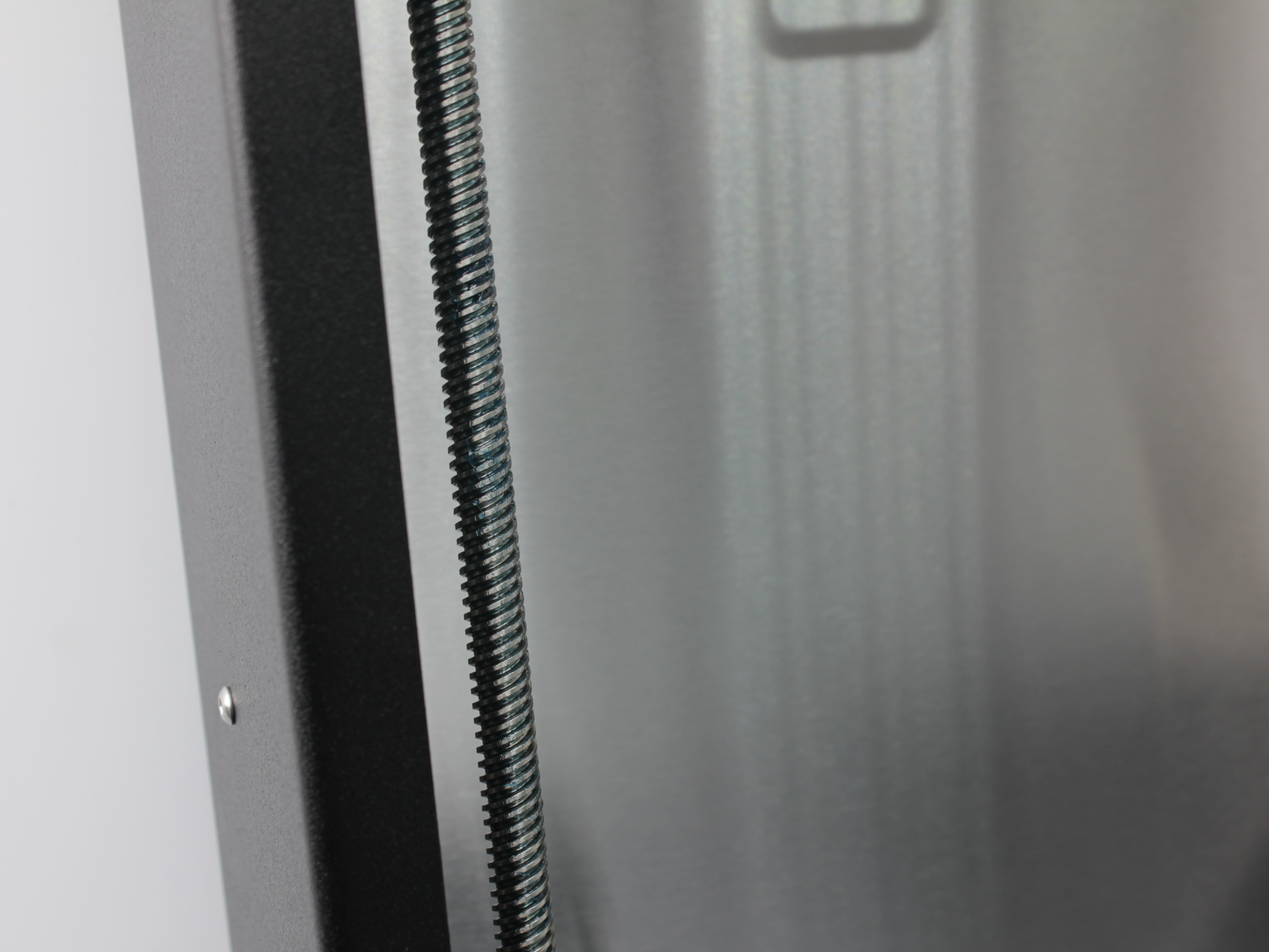 Z-axis lead screw after lubrication showing clean coating