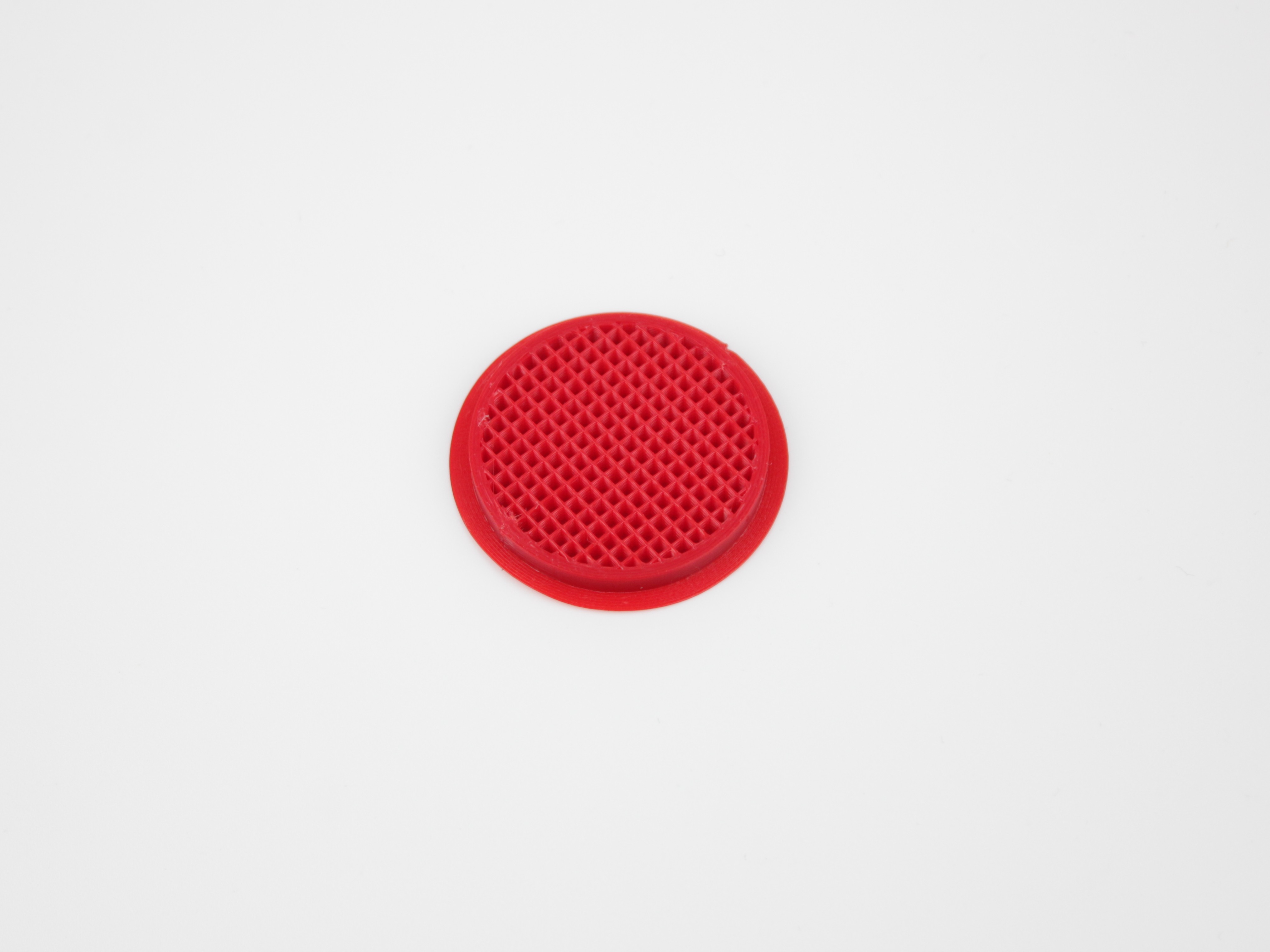 Open-topped test disc showing the perimeters around the outside and the infill inside