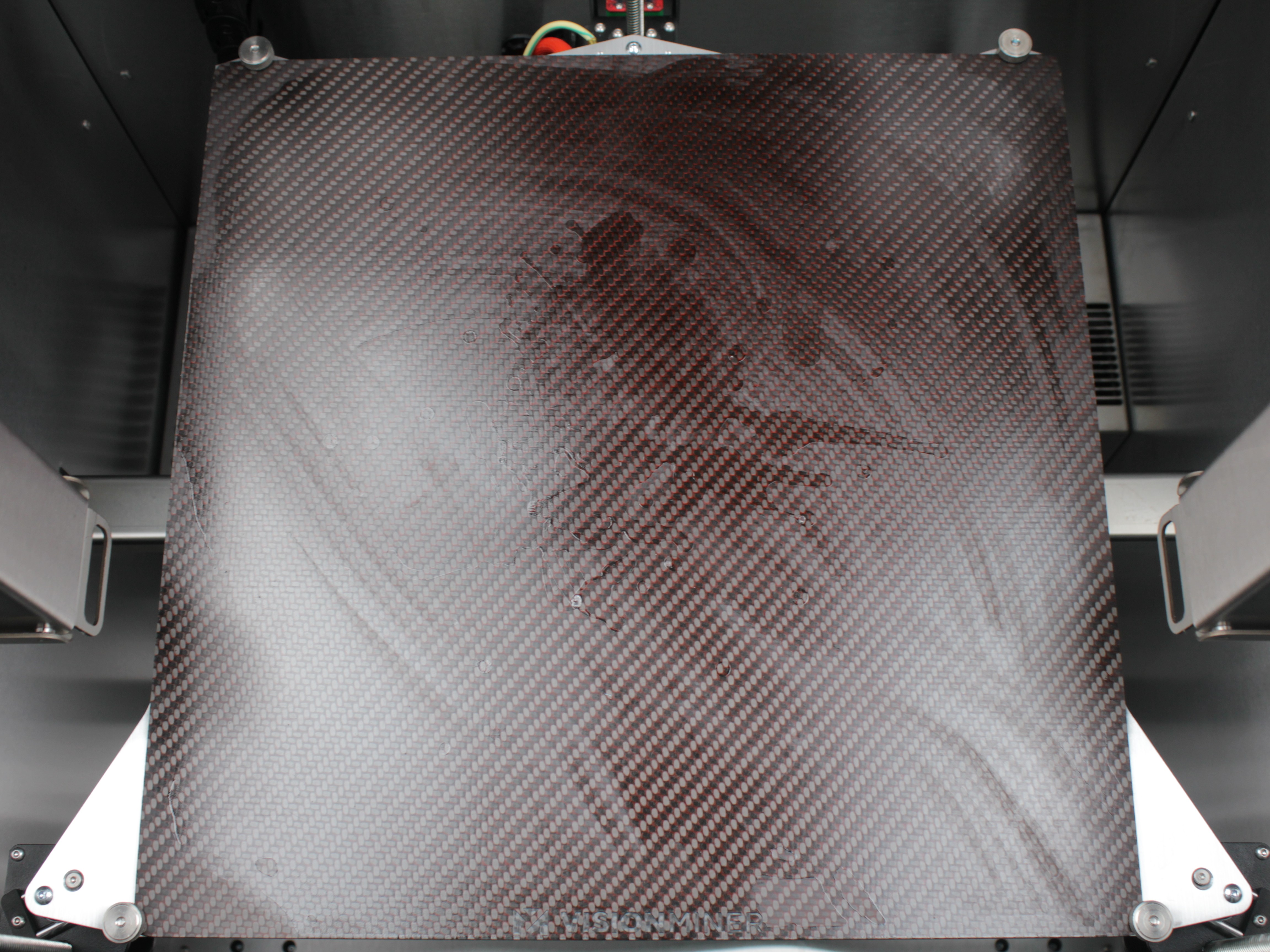 IPA applied to build plate surface to soften hardened NPA layers