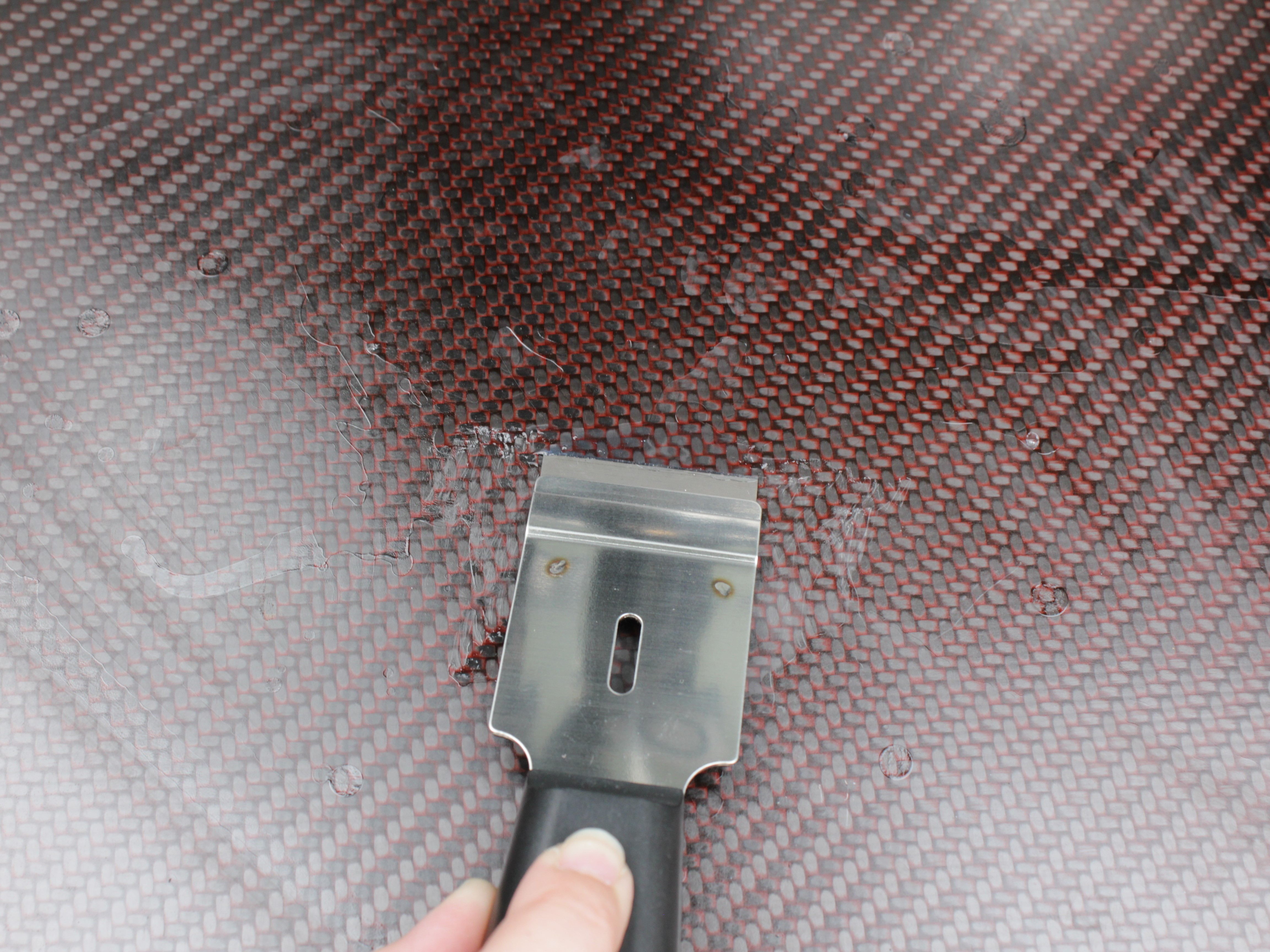 Razor blade used at shallow angle to remove stubborn NPA buildup