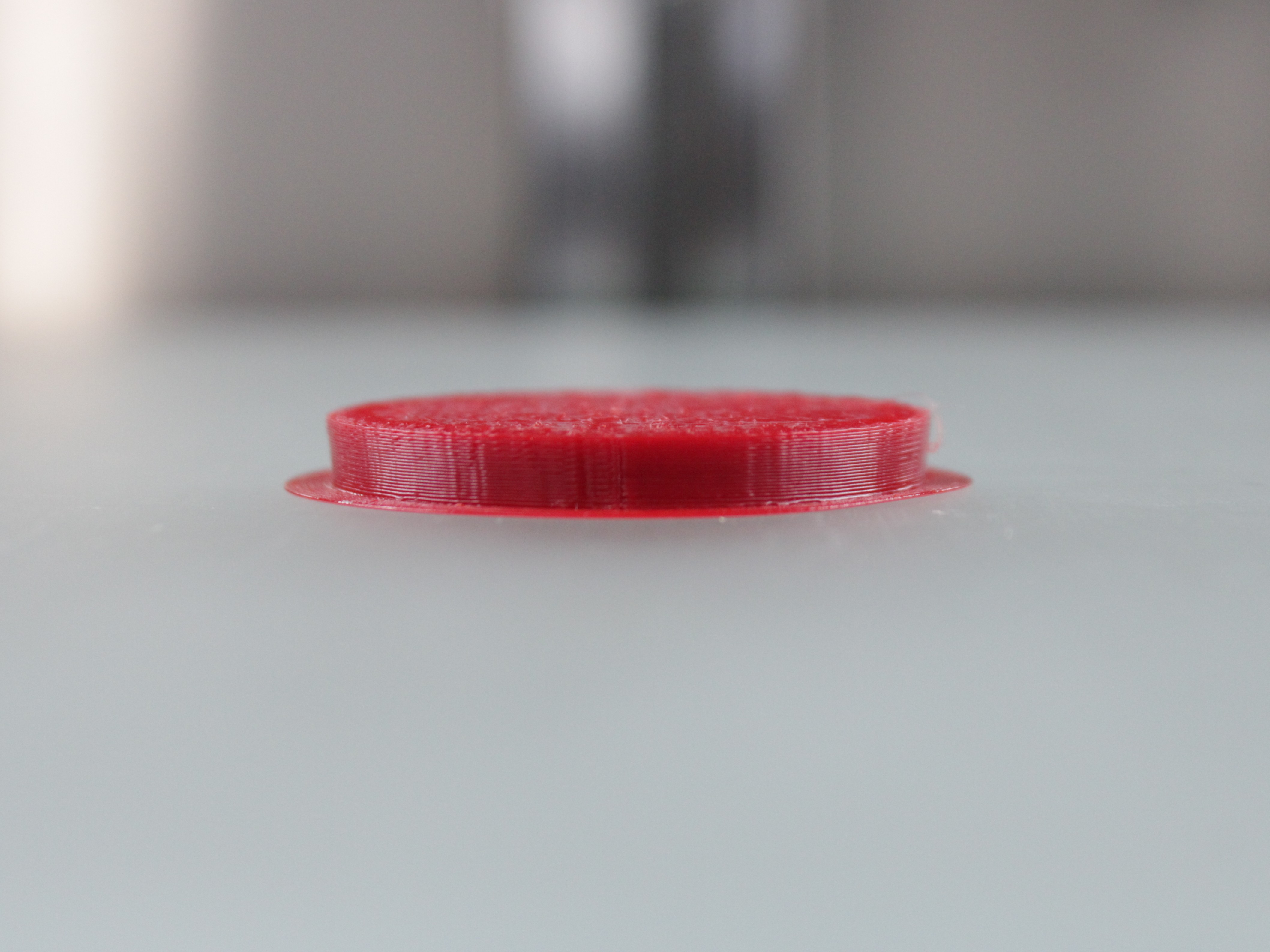 Close-up of warping and lifting on a 100% infill part