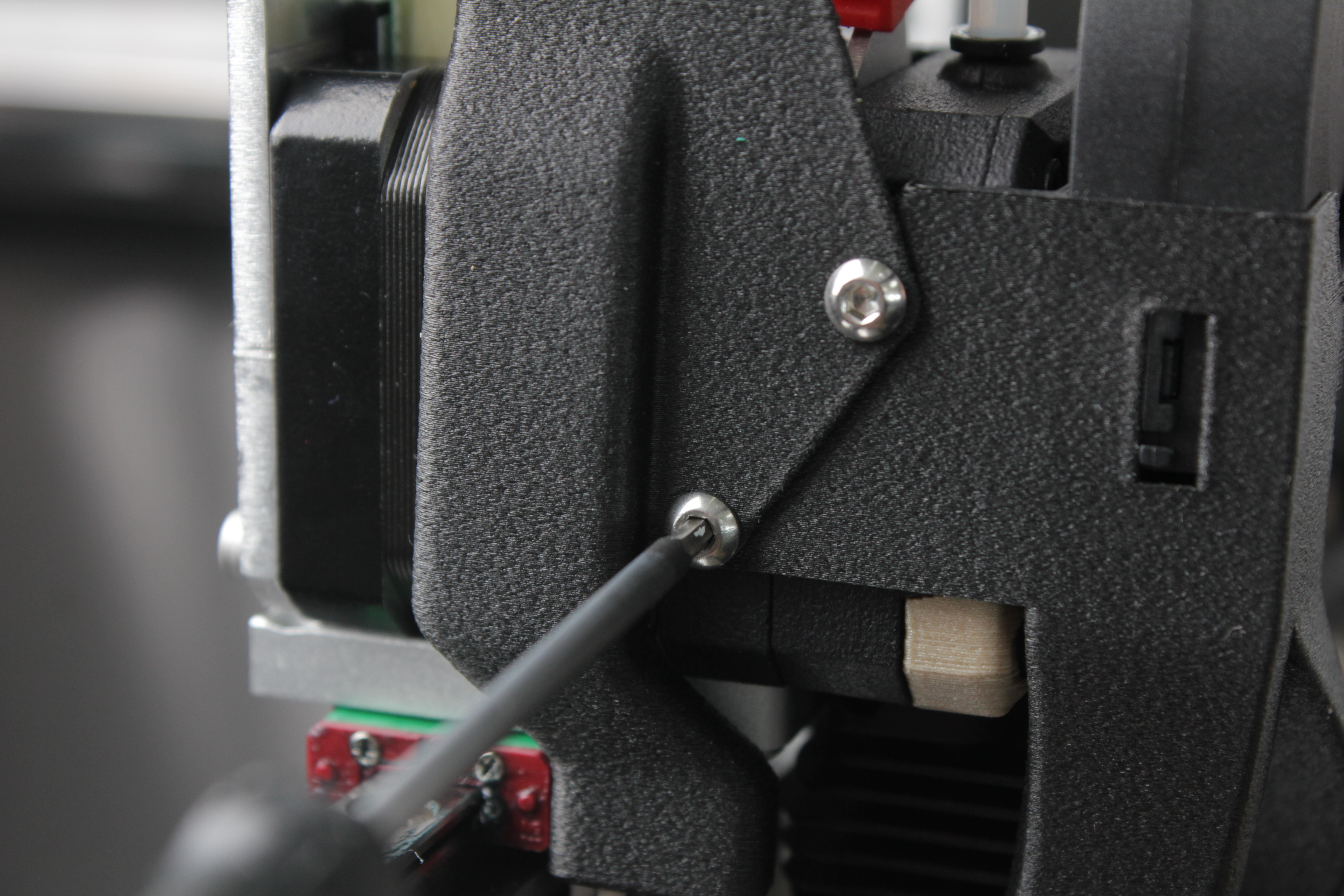 Removing the fan shroud screws and cable cover