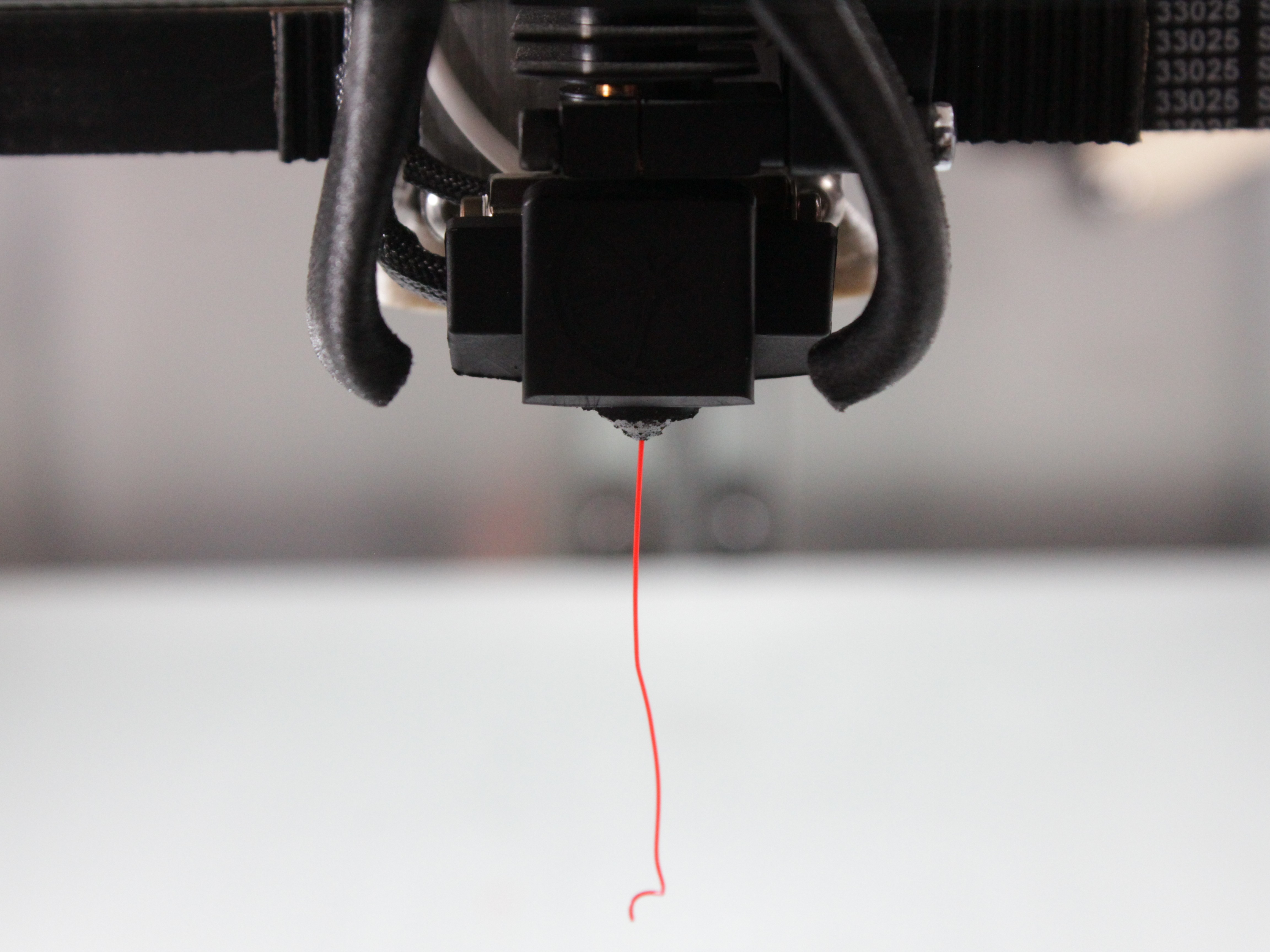 Test extrusion showing clean filament flow from nozzle