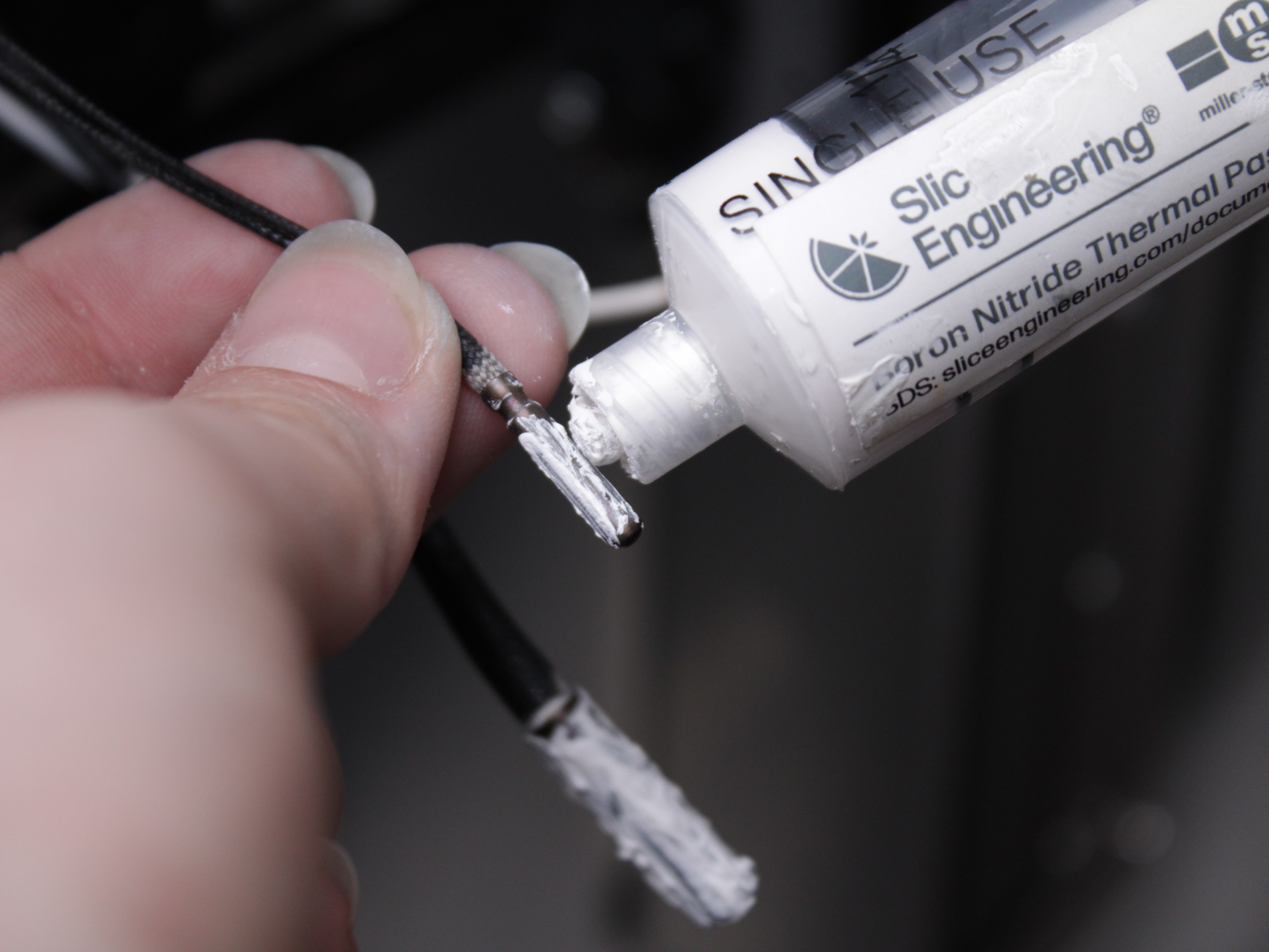 Applying thermal paste to heater cartridge