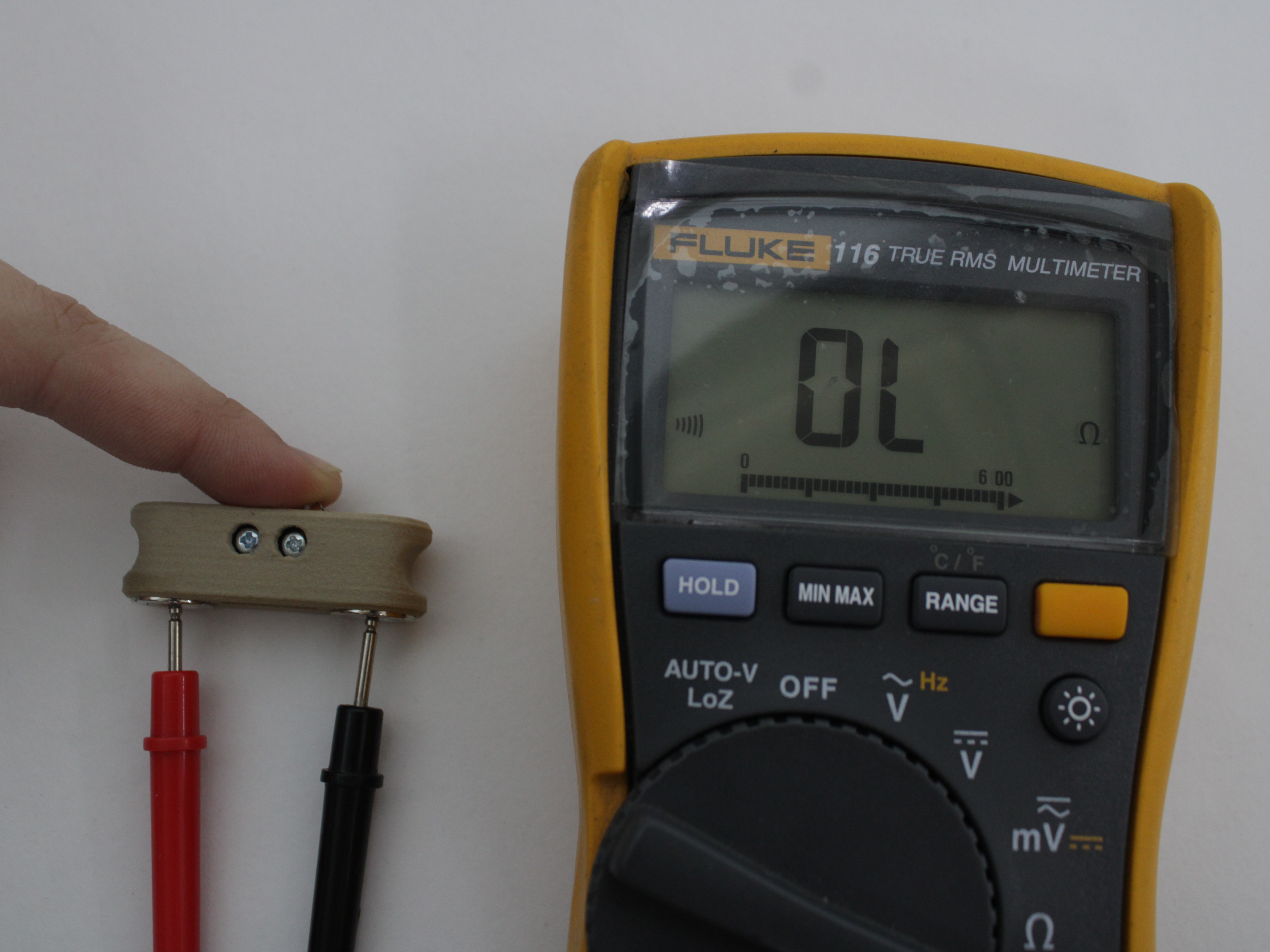 Multimeter in continuity mode with the Z-Probe plunger pressed - reads OL (open circuit)