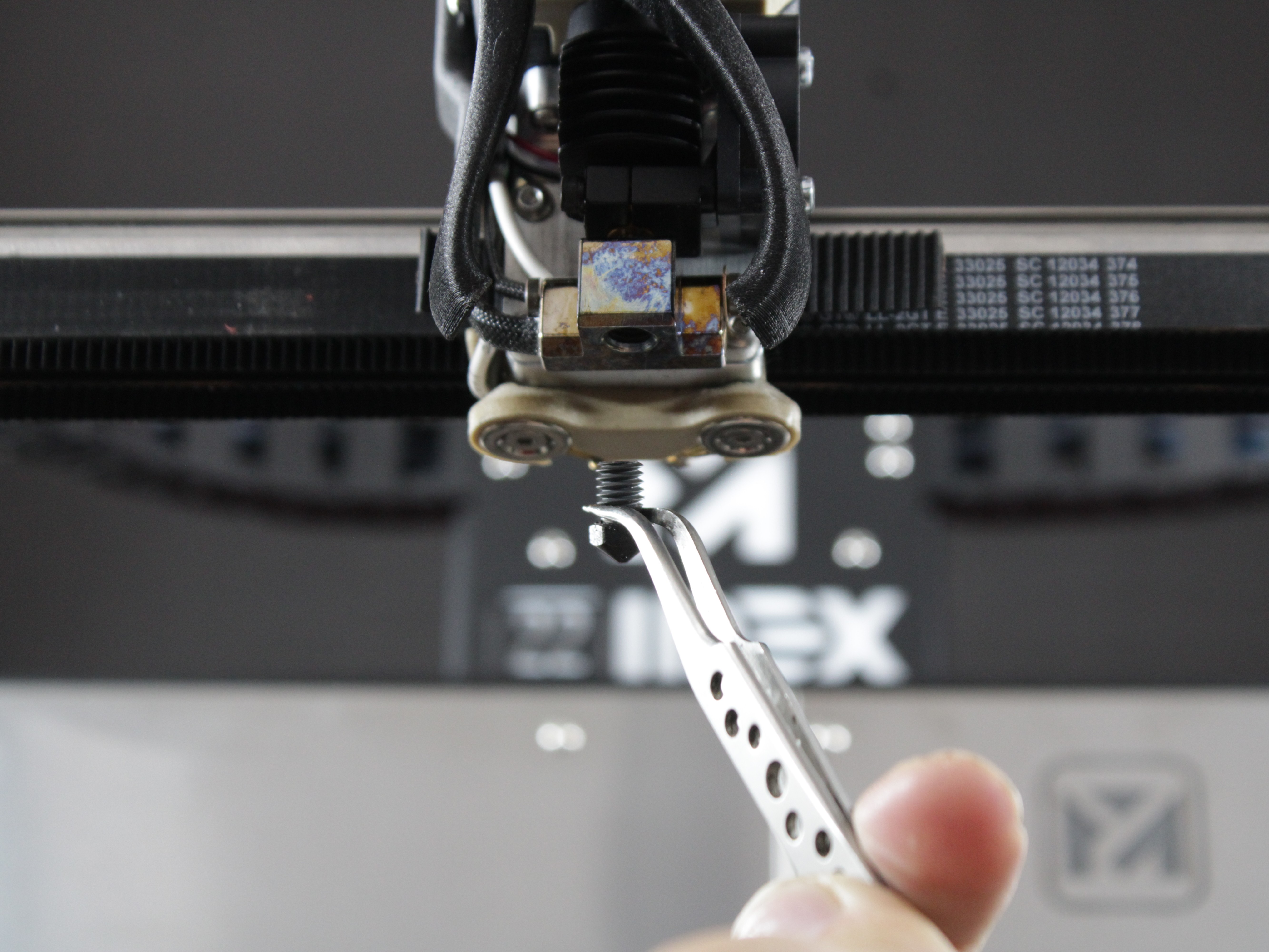 Nozzle removed from heat block showing threads