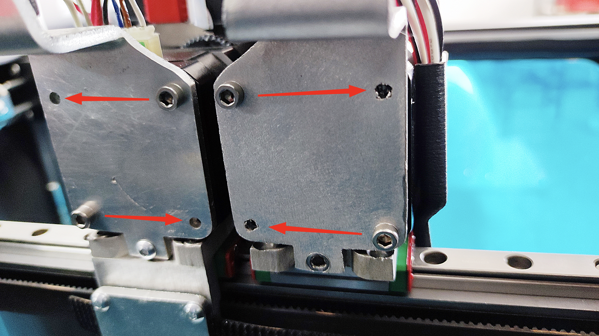 Loosening extruder screw with Phillips screwdriver.