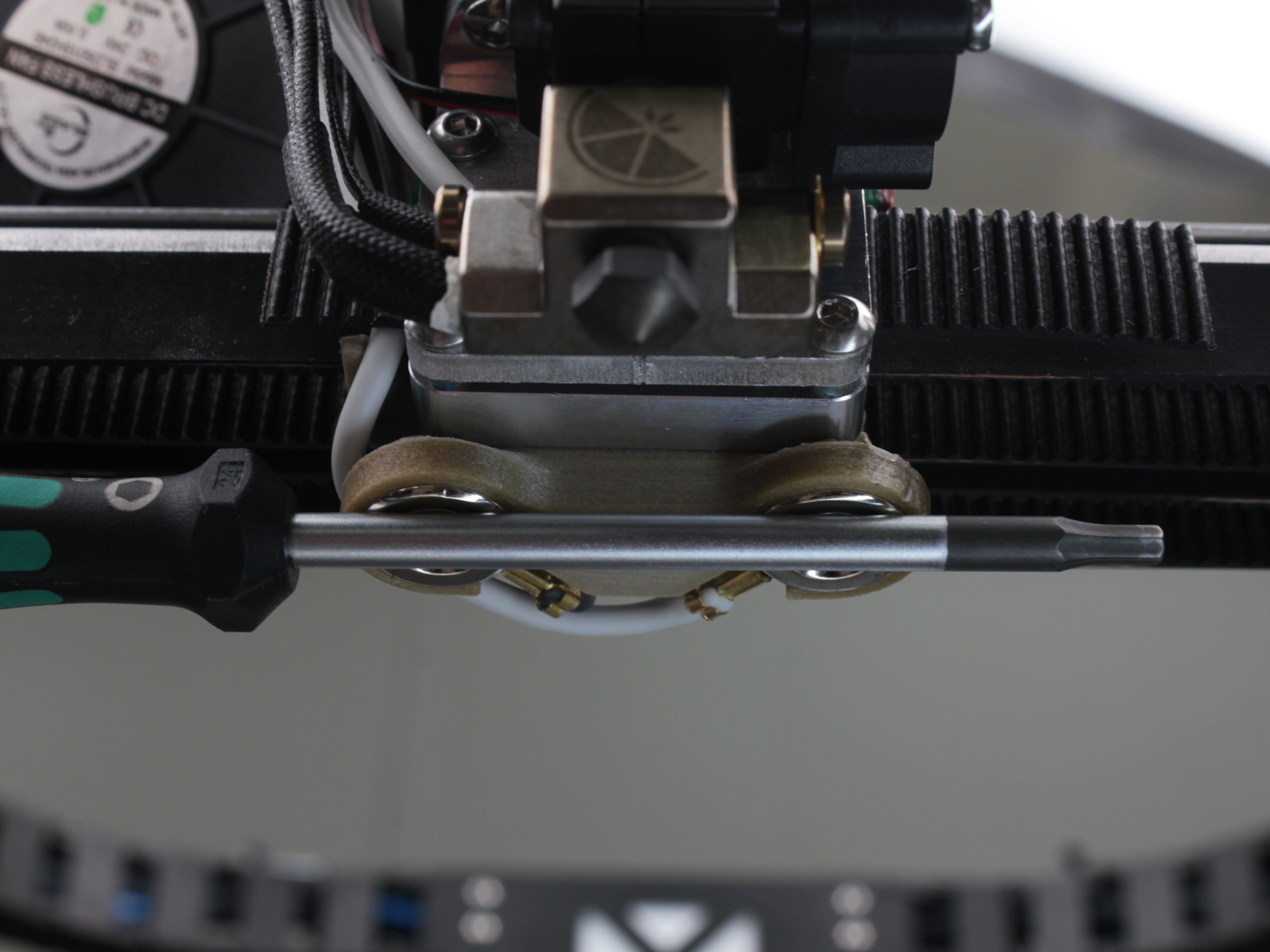 2.5 mm hex driver bridging both Z-Probe magnet contacts on the toolhead holder